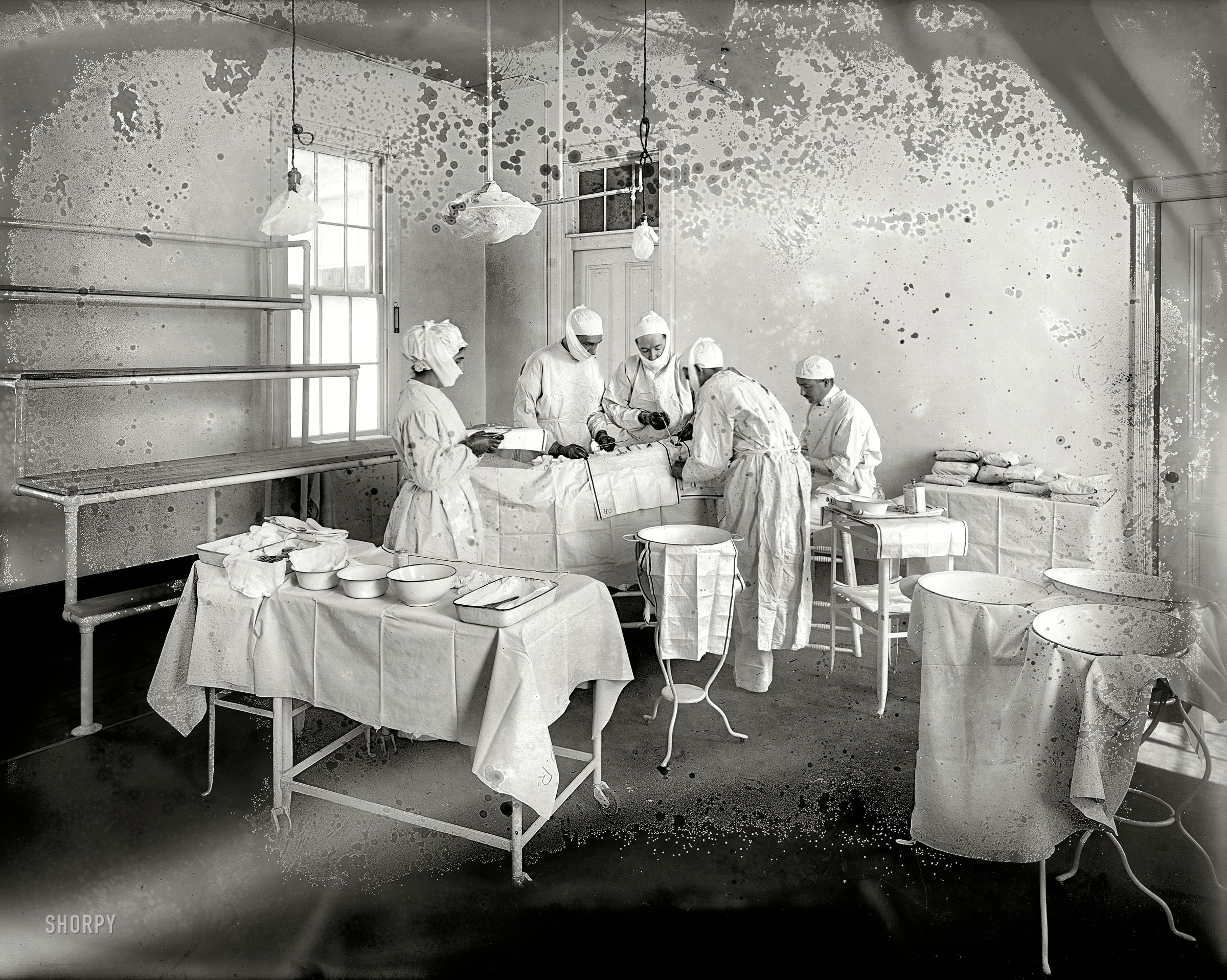March 16, 1915. "Operating Room, Washington Asylum Hospital." More sanitary, one hopes, than the moldy glass plate recording the scene. View full size.