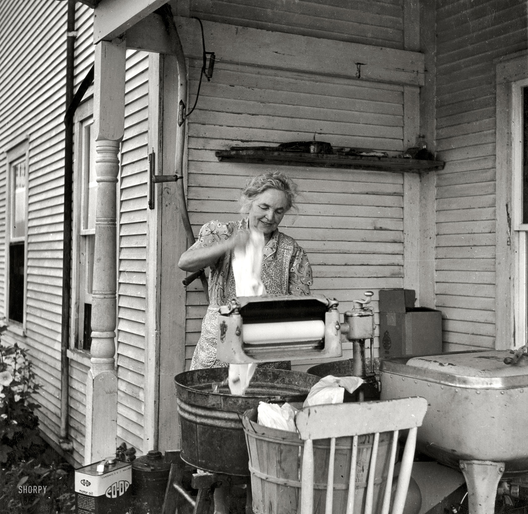 July 1940. "Farm woman washing clothes in her motor-driven washing machine. Near Lincoln, Vermont." Sliver gelatin print by Louise Rosskam. View full size.