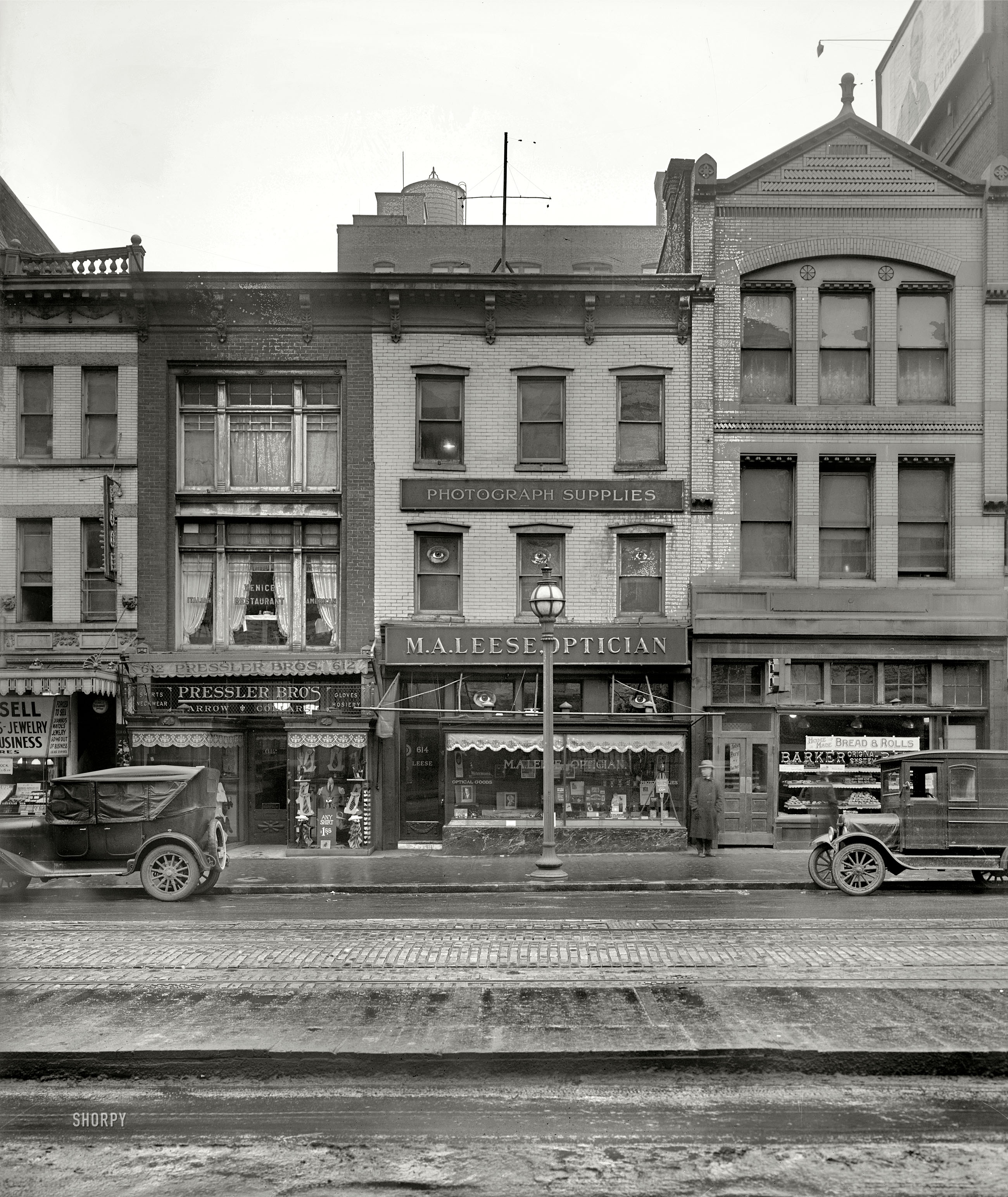 Washington, D.C., circa 1926. "M.A. Leese Optician, 9th Street store." Other businesses represented in this mold-spotted street view include a pool hall, Venice Italian American Restaurant, Pressler Bros. haberdashery and Barker "Original System" Bakery. National Photo Company glass negative. View full size.