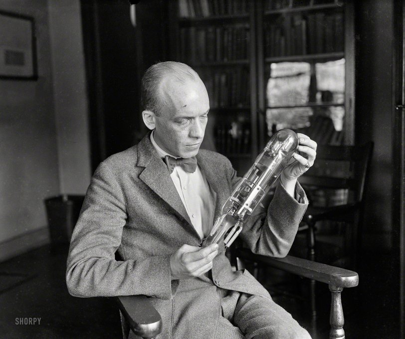 June 1924. Washington, D.C. "Carl W. Mitman, Curator of Engineering, U.S. National Museum [Smithsonian Institution], holding what is believed to be the first radio tube, made in 1898 by D. McFarlan Moore of New York. Radio waves emanating from this tube ignited a bomb a city block away and blew up a miniature of the Battleship Maine." Harris &amp; Ewing glass plate. View full size.

