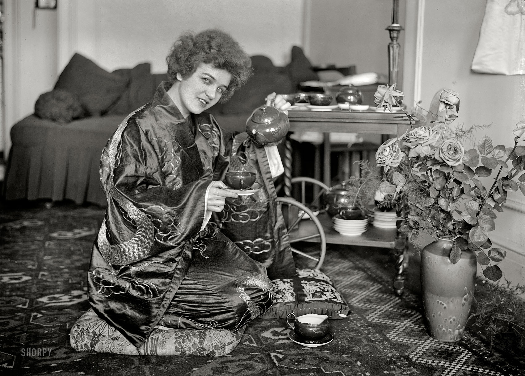 New York. May 21, 1921. "Kopernak in kimono." The Russian-born stage actress Galina Kopernak about to pour. Bain News Service glass neg. View full size.
