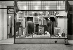 New York, 1921. "Victor record display, New York Band Instrument Co. window." Over two dozen Nippers here by my count, as well as some handsome Victrolas in the kind of place that was the Apple Store of its day. View full size.