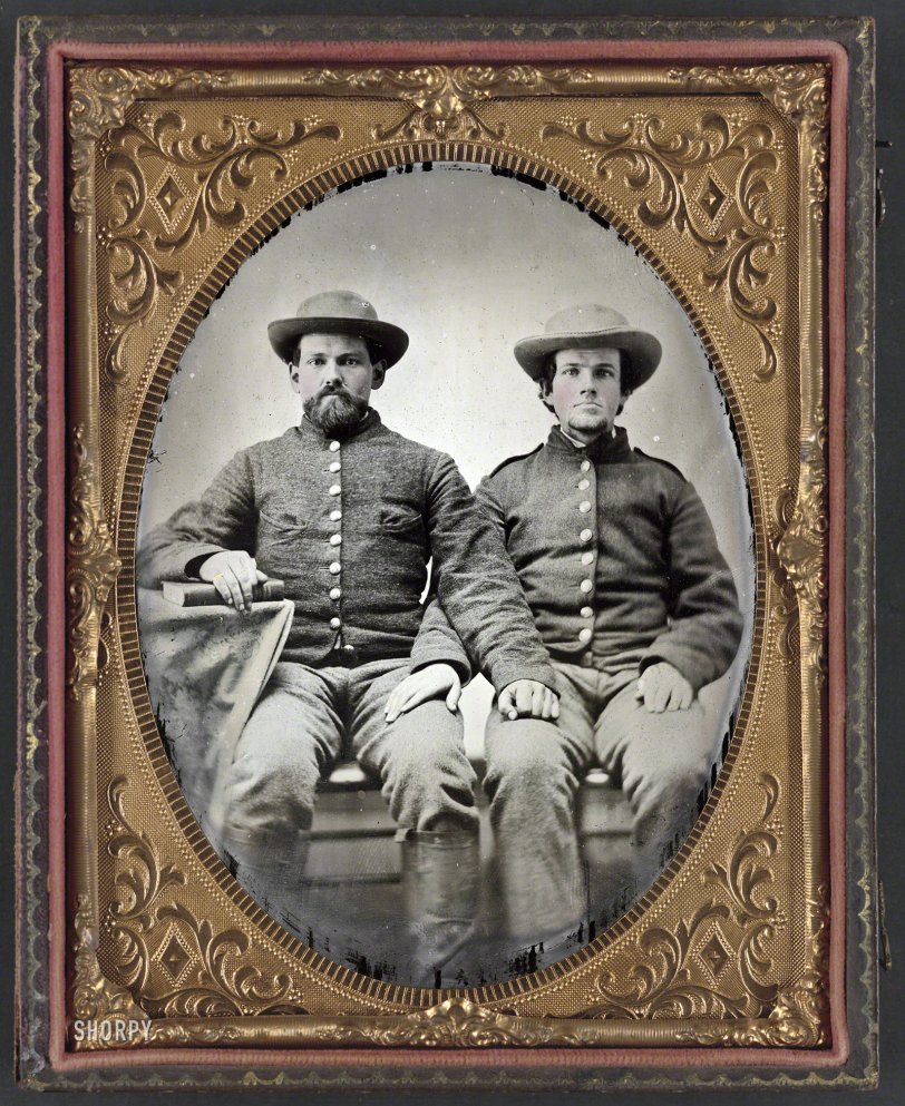 1861-65. "Pvt. Charles Chapman of Company A, 10th Virginia Cavalry Regiment (left), and unidentified soldier." Half-plate ambrotype, hand-colored. Liljenquist Family Collection of Civil War Photographs, Library of Congress. View full size.
