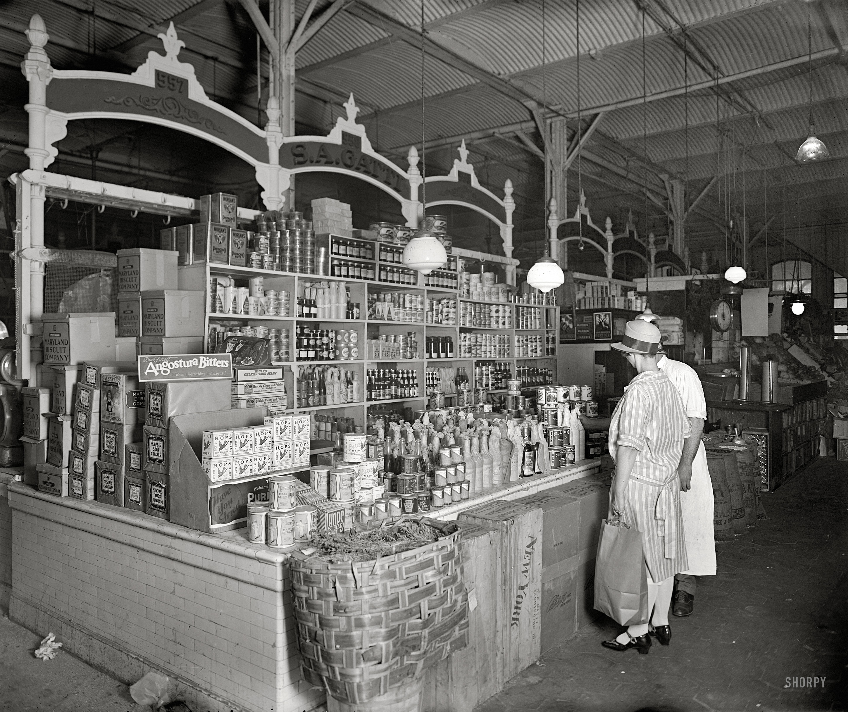 Washington, D.C., circa 1926. "Thomas R. Shipp Co. -- S.A. Gatti stand, Center Market." Offering malt extract, wine jelly and hops, three items for your Prohibition-era shopping list. National Photo glass negative. View full size.