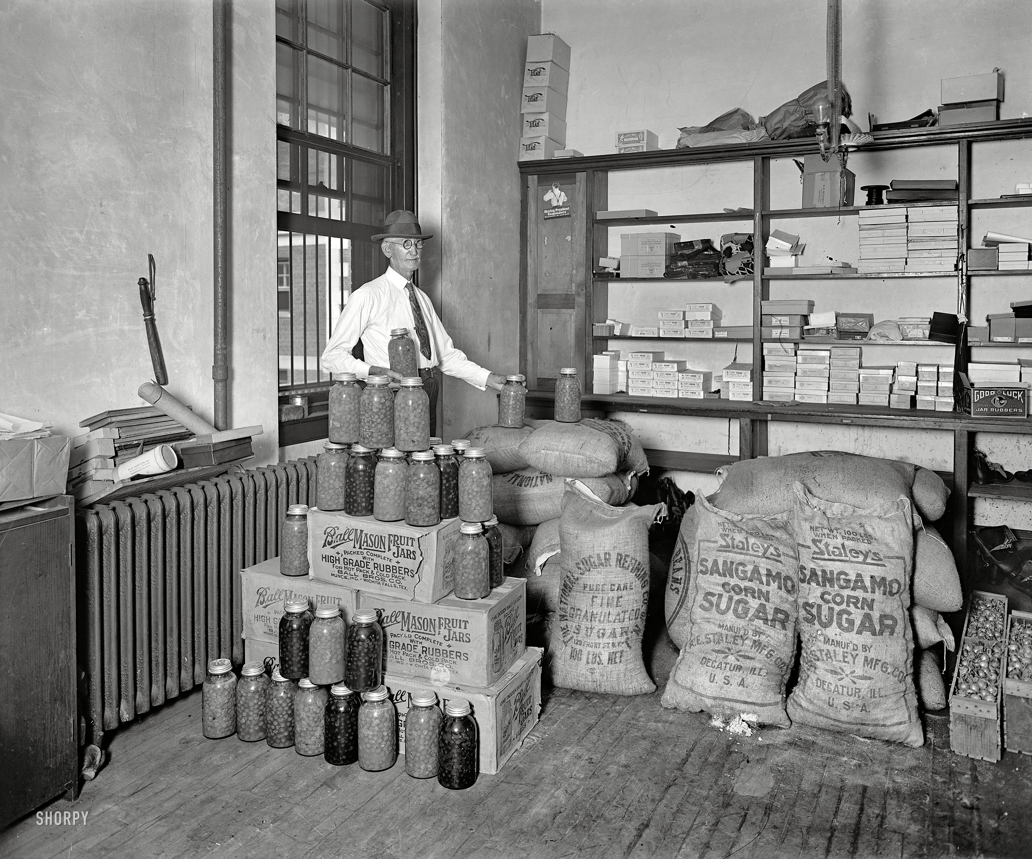 Washington, D.C., circa 1929. "Utilization of confiscated bootleg paraphernalia." Waste not, want not, especially when it comes to "jar rubbers." View full size.