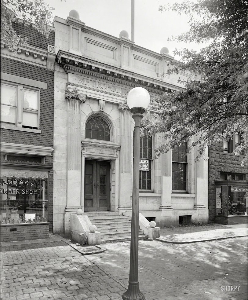 Washington, D.C., circa 1928. "Library for Blind, B Street S.E." Another of those photos where the points of greatest interest are at the periphery -- the Sanitary Barber ("Ladies Hair Bobbing a Specialty") at left, and Hall-Kerr Motors, a Hudson dealer, on the right. National Photo glass negative. View full size.
