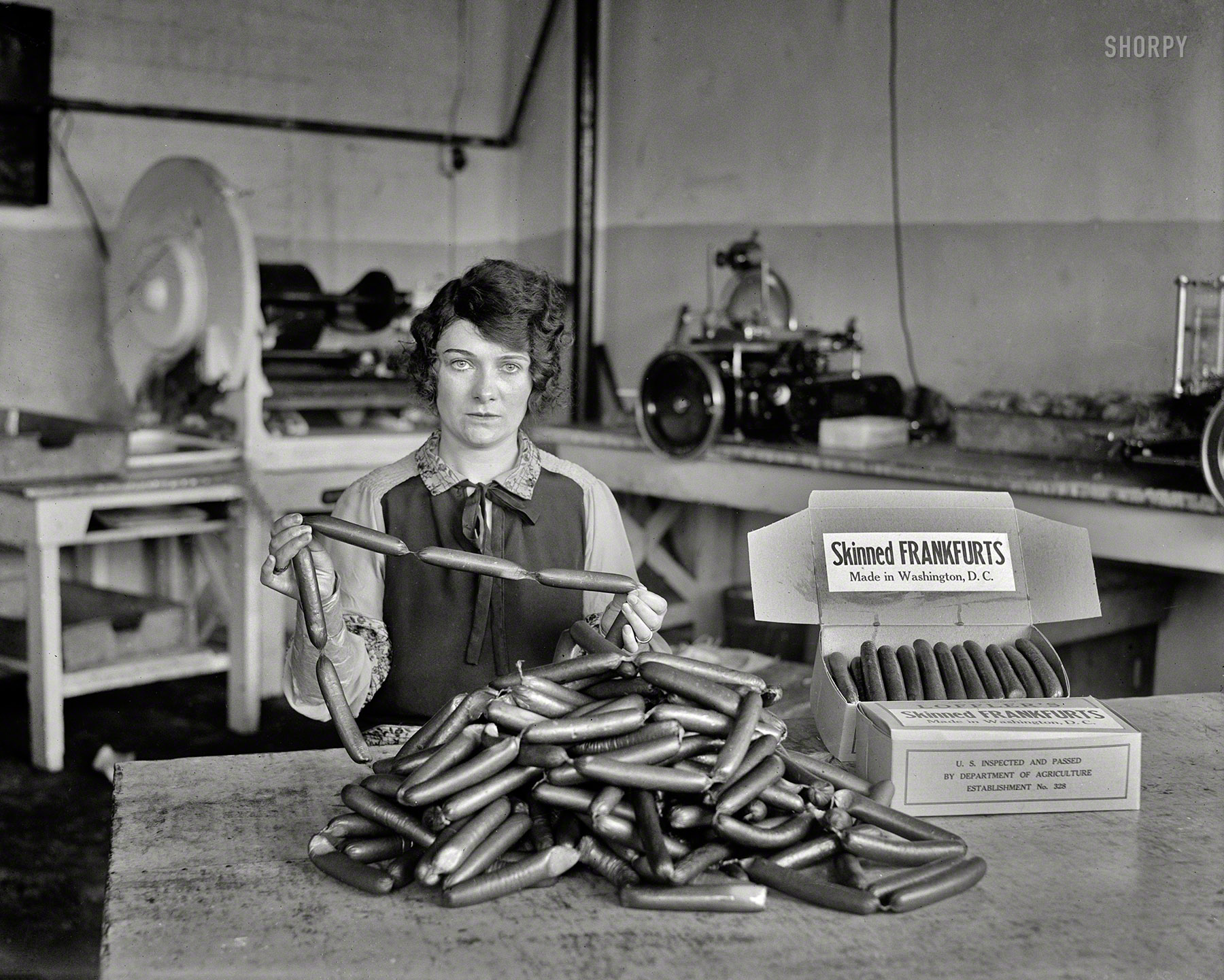 1927. "Skinned frankfurts, made in Washington, D.C." What Bismarck said about laws and sausages: It turns out you can watch them (or not watch them) being made in the same place. Harris & Ewing glass negative. View full size.