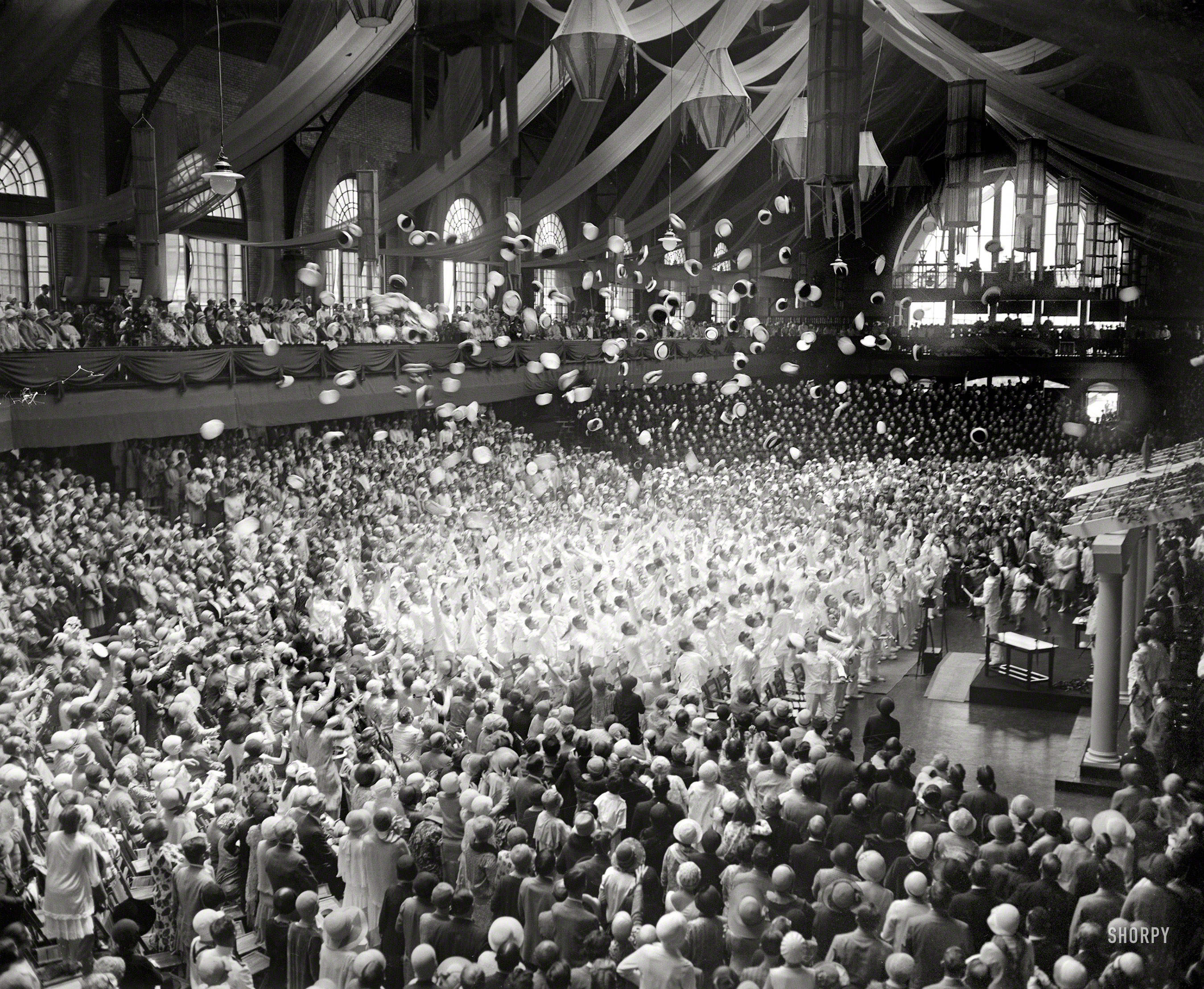 June 6, 1929. Annapolis, Md. "Graduation, U.S. Naval Academy." Midshipmen doing the traditional cap-toss. Harris & Ewing glass negative. View full size.