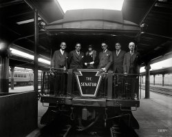 UPDATE: The photo now has a caption.

October 1, 1929. The new crack train from Washington to Boston was inspected today by members of the Massachusetts State Society. Harry Carr of the Pennsylvania R.R. was host. Left to right: Wm. T. Simpson, Treasurer; Frank E. Hicks, Vice Pres.; Mrs. Proctor L. Daugherty; Geo. R. Farnum, Pres. and Assistant Attorney General of the United States; Geo. A. Hornan, Secretary; and Chas. A. Bauman.

Circa 1929 at Washington's Union Station, it's the Senator. Which senator, maybe someone out there knows. Unlabeled Harris & Ewing glass plate. View full size.