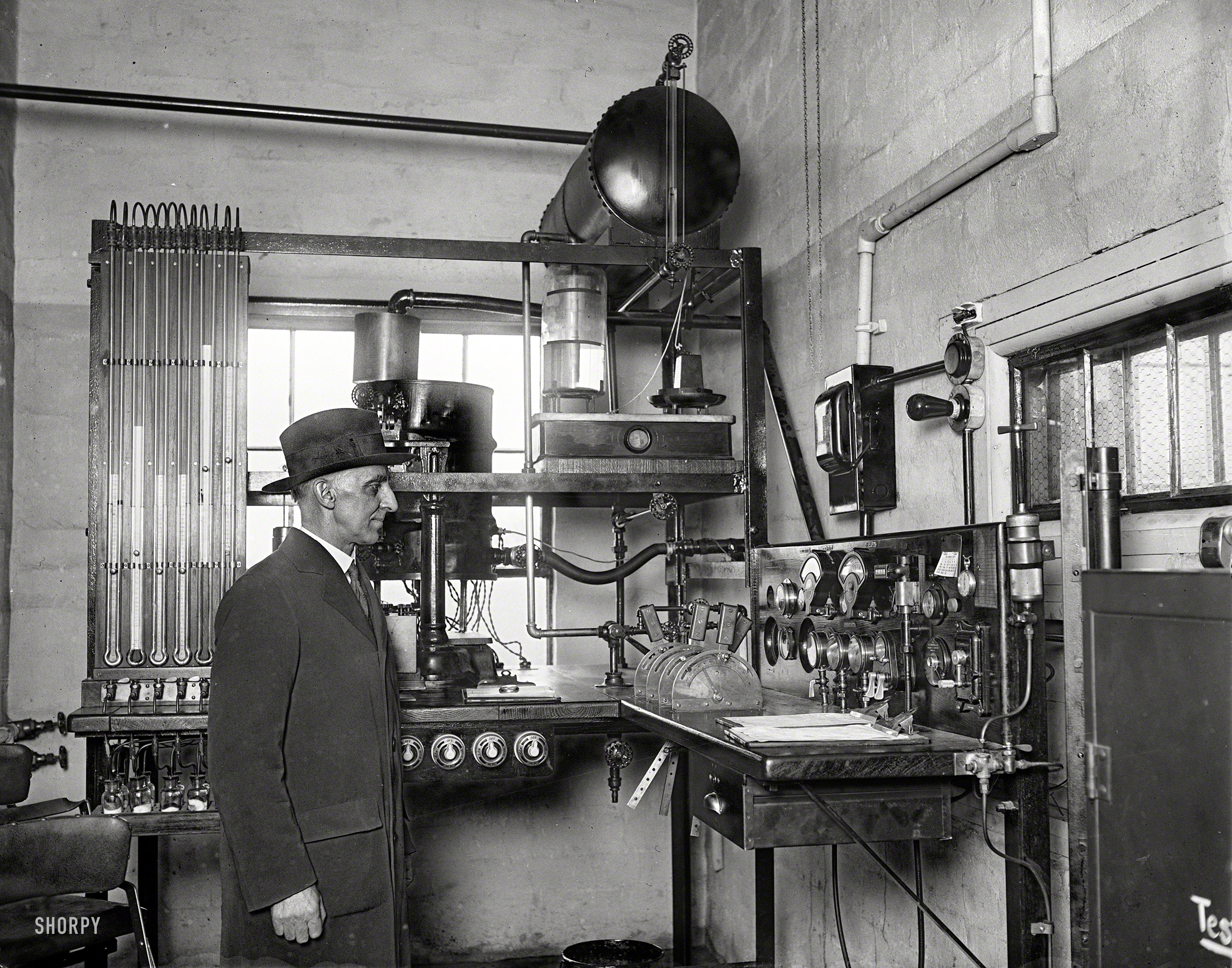 December 30, 1929. "Dr. K.C. Dickinson, chief of the Heat and Power Division of the Bureau of Standards, and the control room of the new aircraft engine testing laboratory at Arlington, Virginia. Here all engines for use on licensed airplanes are to be tested. The control room and the room in which the engines are mounted are heavily reinforced with concrete to prevent flying engine parts striking the observers." Harris & Ewing Collection glass negative. View full size.