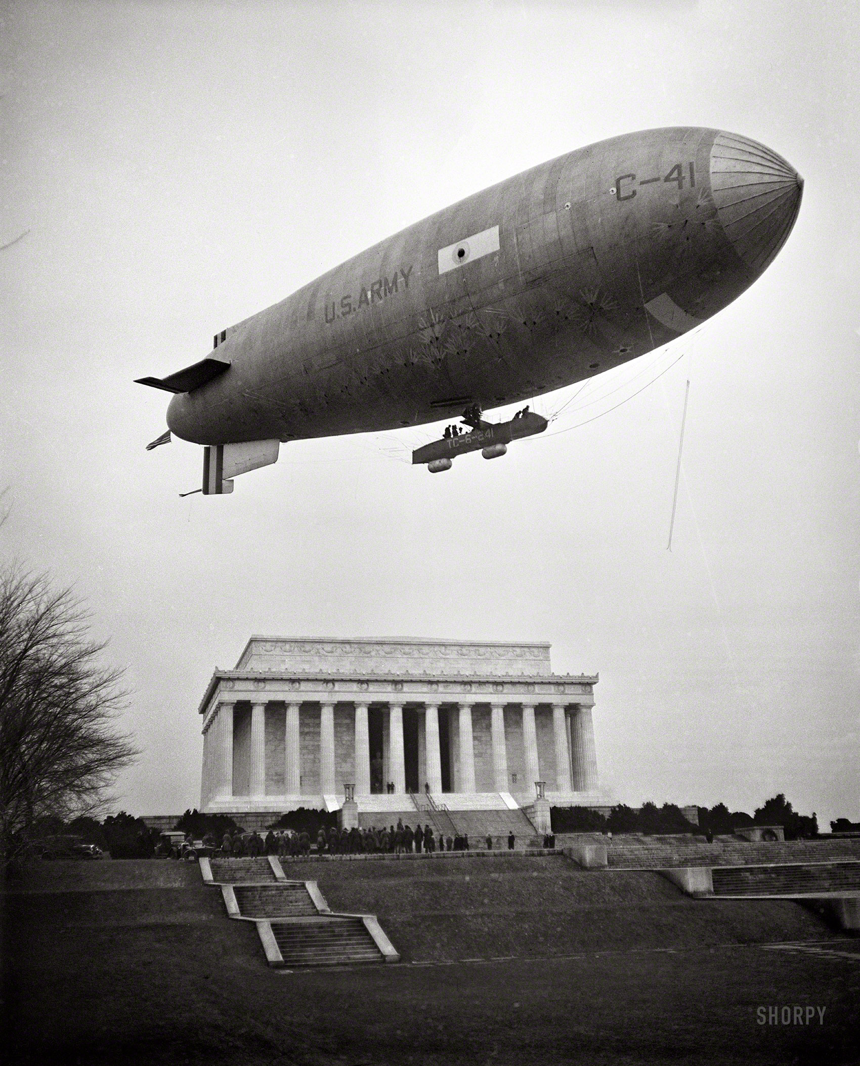 February 1930. Washington, D.C. "Army Airship C-41 lands on Mall and airmen, led by Brigadier General William J. Flood of the 19th Airship Company, place wreath at Lincoln Memorial, honoring Lincoln's Birthday." Harris & Ewing Collection glass negative. View full size.