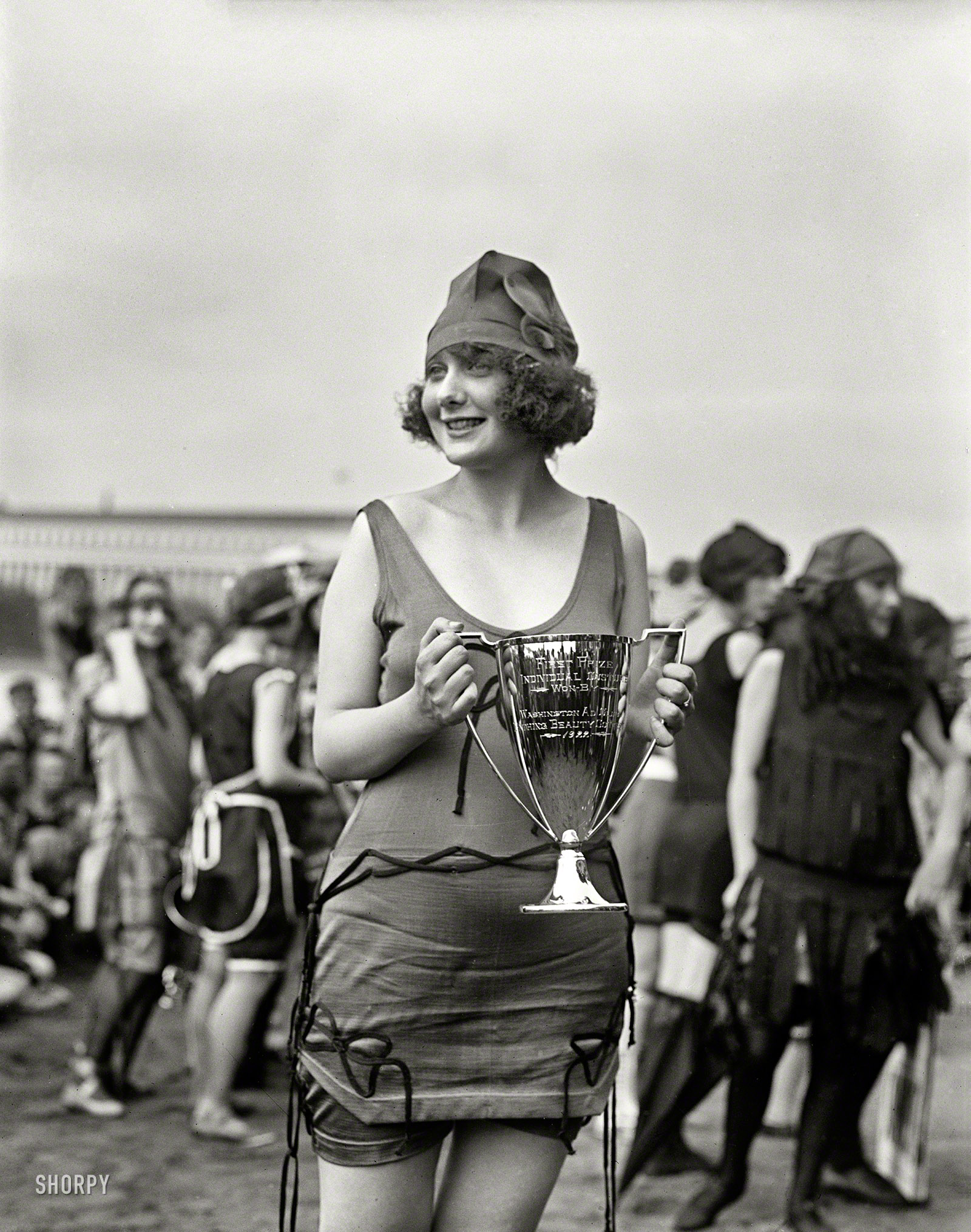 June 17, 1922. "Washington Ad Club bathing costume contest at Tidal Basin." Miss Anna Niebel, "former Follies girl who lives at 1370 Harvard street northwest," took first place. At right, the unmistakable if blurry figure of Iola Swinnerton, First Lady of Shorpy, who came in second. Harris & Ewing glass negative. View full size.