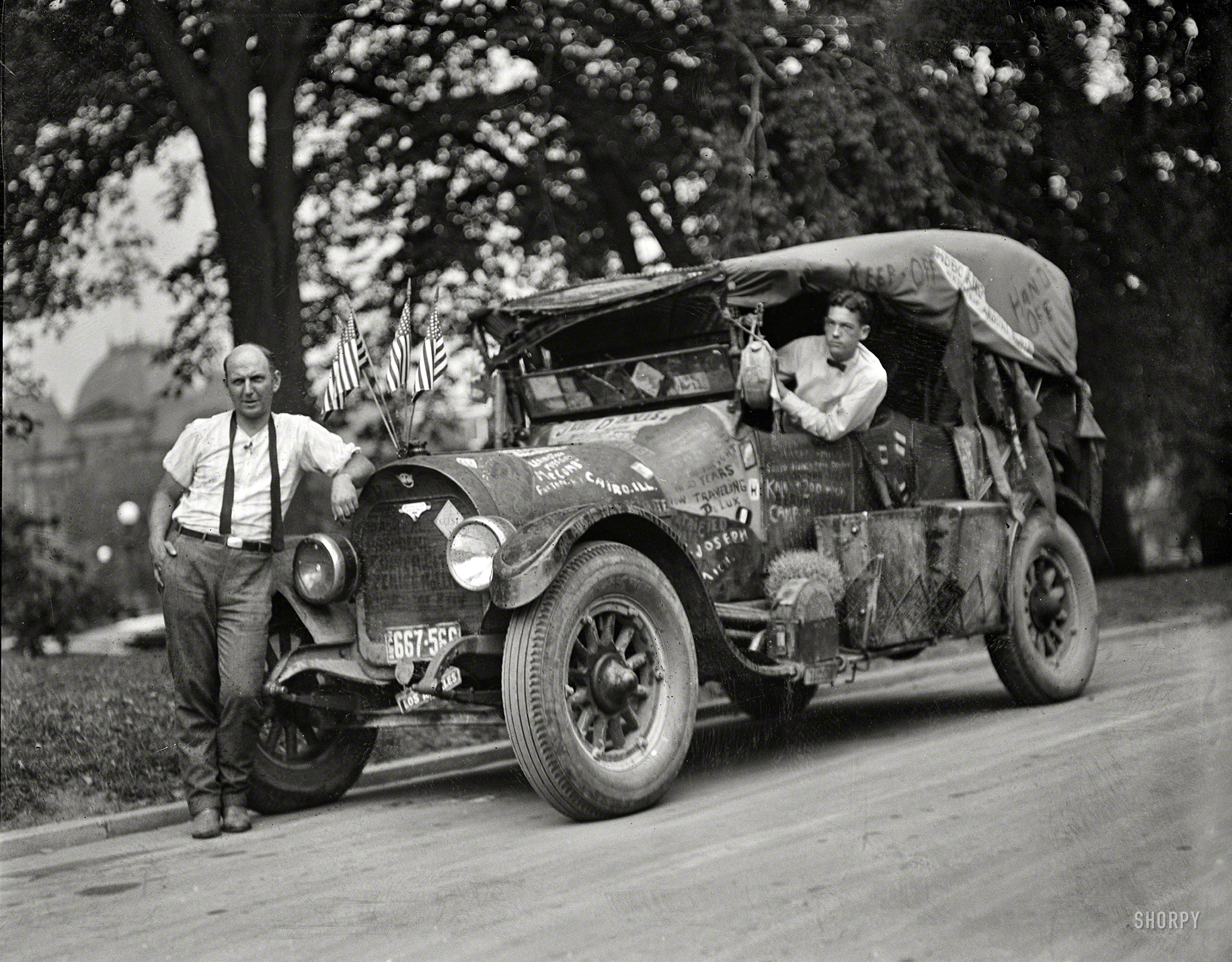 August 1924. Washington, D.C. Jeff Davis, self-styled Hobo King (as well as founder of various Hotels de Gink, a chain of hostels for the homeless), standing next to his jalopy and driver. Harris & Ewing glass negative. View full size.