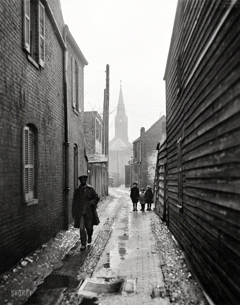 Washington, D.C., or vicinity, 1925. "Alleyway." Who can identify the church? Harris &amp; Ewing Collection glass negative. View full size.
