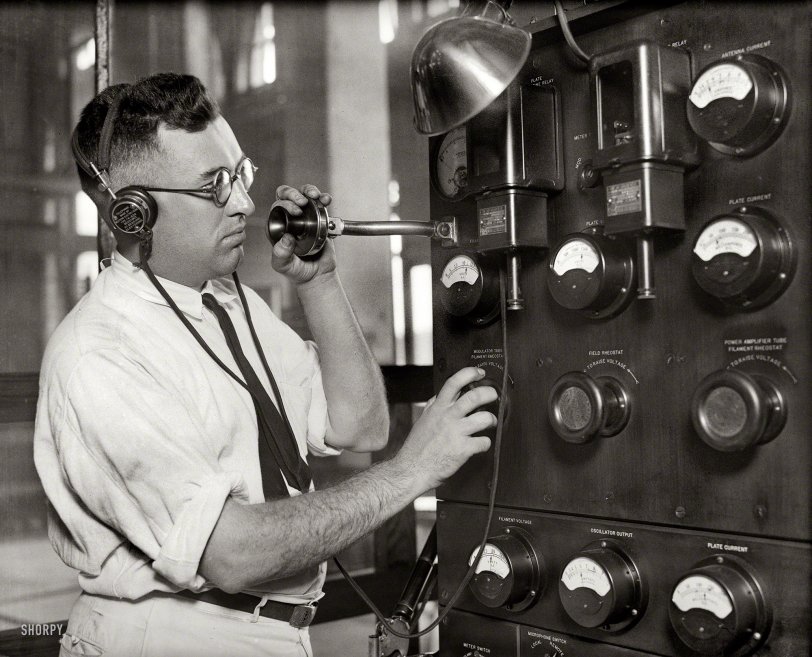1925. Washington, D.C. "Broadcasting equipment." Adjusting the "modulator tube filament rheostat." Harris &amp; Ewing glass negative. View full size.
