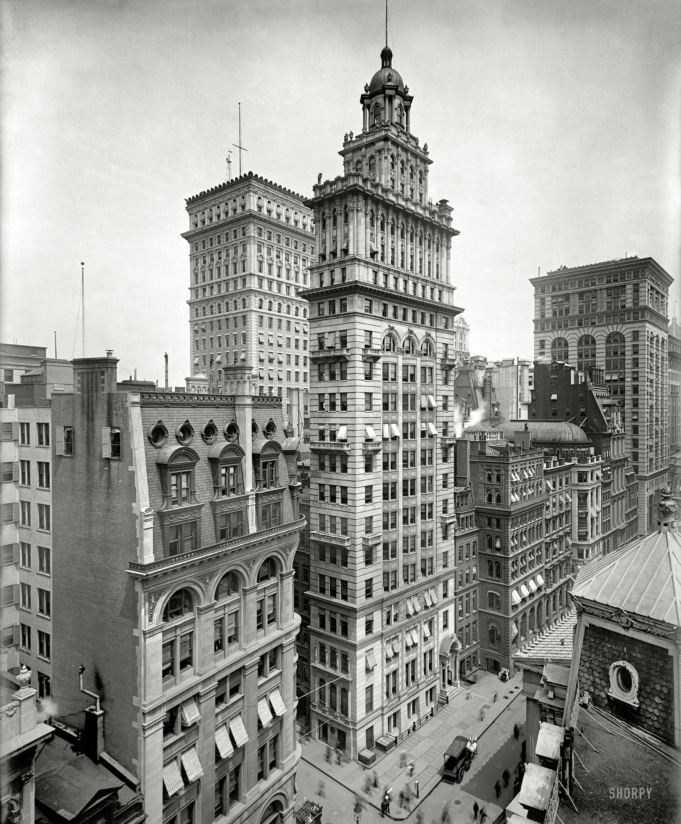 New York circa 1900. "Gillender Building." This improbably slender tower at the corner of Nassau and Wall Streets, one of the tallest buildings in the city when it was completed in 1897, met the wrecking ball in 1910. View full size.