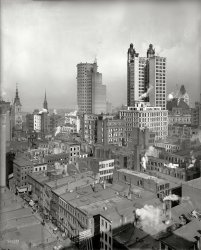 New York, 1900. "St. Paul and Park Row buildings, two tallest buildings in the world." Note the campaign banner at the bottom of the photo, shot from the Woodbridge building. 8x10 glass negative, Detroit Publishing. View full size.
Tiny Sample HatsWhen we emptied out my parents' house of 54 years worth of stuff saved, I found two small miniature oval hat boxes in perfect condition from Knox Hats.  Each contained a finely detailed sample of one of their products and I saved them because they were so unique.  After seeing this picture today I put "Tiny Knox Hats" in the search space and came up with pages of info, several of which were people selling salesmens' samples of same.  I had no idea these are collectible and now I have to find the ones I brought home which were not shown on the "vintage collectibles" auctions.  My father always wore a hat and he had many including Knox, Adams, Dobbs, Stetsons, Danbury, Russian fur, Panamas, etc. and I donated them all to a thrift store.  Now I wish I had them. We get too soon old and too late smart.
Man on LedgeIf you look at the building (the one with all the window shutters open) to the right of the Knox the Hatter building, you will see a man standing on a ledge on the floor just below the roof.  There is a large oil or water tank to his right.  I don't think he was a window washer.  Could he have been a sign painter who was about to paint a message on the large black rectangle on the side of the building right in back of him?  To say that he is perched precariously would be an understatement.
DPOC TCCThey'd probably just turn themselves into an acronym today
I would say the photo is circa September 26, 1896. 
[McKinley ran with Roosevelt in 1900, not 1896. Also, the Woodbridge Building was erected in 1897. - tterrace] 
Whoops, I stand corrected.  This was for his 2nd term campaign.  The extract I posted from the New York Times (deleted by Shorpy, I guess) was in preparation for his 1st term.
Hat HistoryKnox the Hatter was clearly a mover and shaker in Old New York. Read all about it here and here.
Knox the HatterDuring my commuting days I remember seeing a Knox Hats shop on 8th Ave across the street from the Port Authority. They had a beautiful neon sign and it stood out from the other grimy storefronts along the street.  
Armeny &amp; Marion PensIn the early 1870's Armeny &amp; Marion Co. made extension pens under their own name, but they soon began to make these along with gold filled caps for stylographic pens and gold bands to supply other pen makers. Armeny &amp; Marion Co. was a very early investor in Lewis Waterman's Ideal Pen co.
Armeny &amp; Marion Co
Skyscrapers in search of a paradigmIt's interesting to see that these structures are, despite their giant size, still following the model of the storefronts and brownstones at the bottom of the frame -- embellished street-front facades, with the rear and sides very plain or totally unadorned, resulting in two or three completely different architectural treatments for the same building. Note the blank-faced section of the St. Paul facing us, fronted with a zillion bricks, enclosing the ventilation and elevator or stair shafts. It looks like an urban grain elevator. (For the street-front sides, see this view.)
Where&#039;s the water?The first thing I noticed are the missing water towers. I see a few, but if you look out onto NYC rooftops today all you'll see are the water towers, looking like fat, rusty spaceships.
Park Row &amp; St. Paul 1908This postcard from a New York City friend, was sent to my grandparents in August of 1908.
May have answered my questionI think I may have found the reason why the aforementioned man is perched on the ledge of the building with all the shutters open.  I started looking more closely and discovered that there is another man two floors below and slightly to the left that seems to be on a scaffold.  It looks as though he is painting the shutters.  If you look in back of the first man higher up, you can see a bucket.  It looks as if these two were painters.  This would also explain why all the shutters were thrown open the way they were:  they had just been painted and were in the process of drying.
Bldgs and streets?Can someone please post a current view, and ID the tallest spires and the streets that are visible? Is that the old Post Office to the right of the 2 skyscrapers? Is view to west or northwest?
(The Gallery, DPC, NYC)