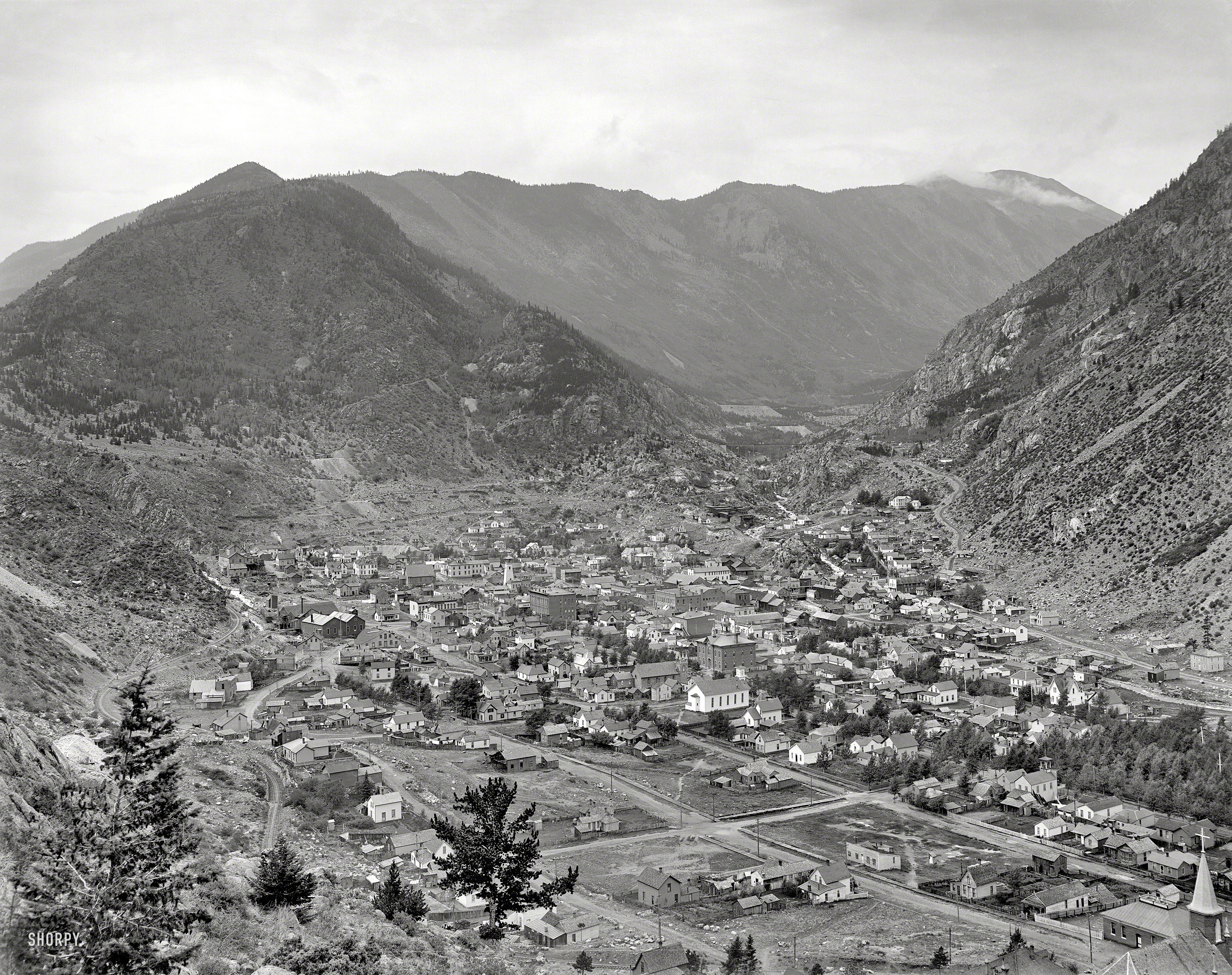 "Clear Creek Cañon." Georgetown, Colorado, circa 1901. Famous for the Georgetown Loop, a narrow-gauge railroad visible in the distance. 8x10 glass plate by William Henry Jackson, Detroit Publishing Co. View full size.