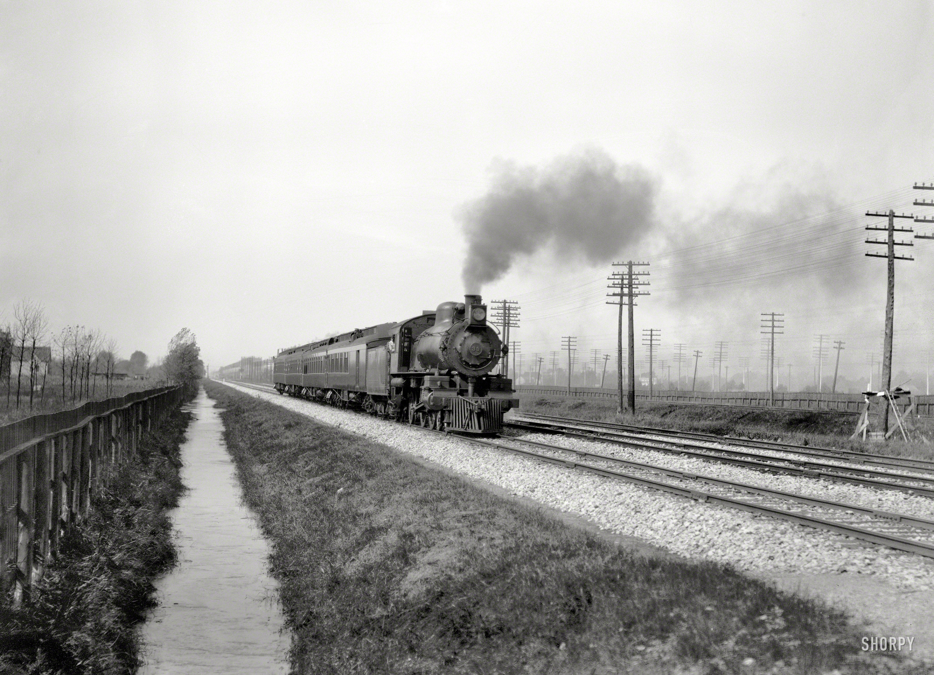 Circa 1905. "Pennsylvania Flyer, eastbound." Heading past Telegraph Pole National Forest. 8x10 inch glass negative, Detroit Publishing Co. View full size.