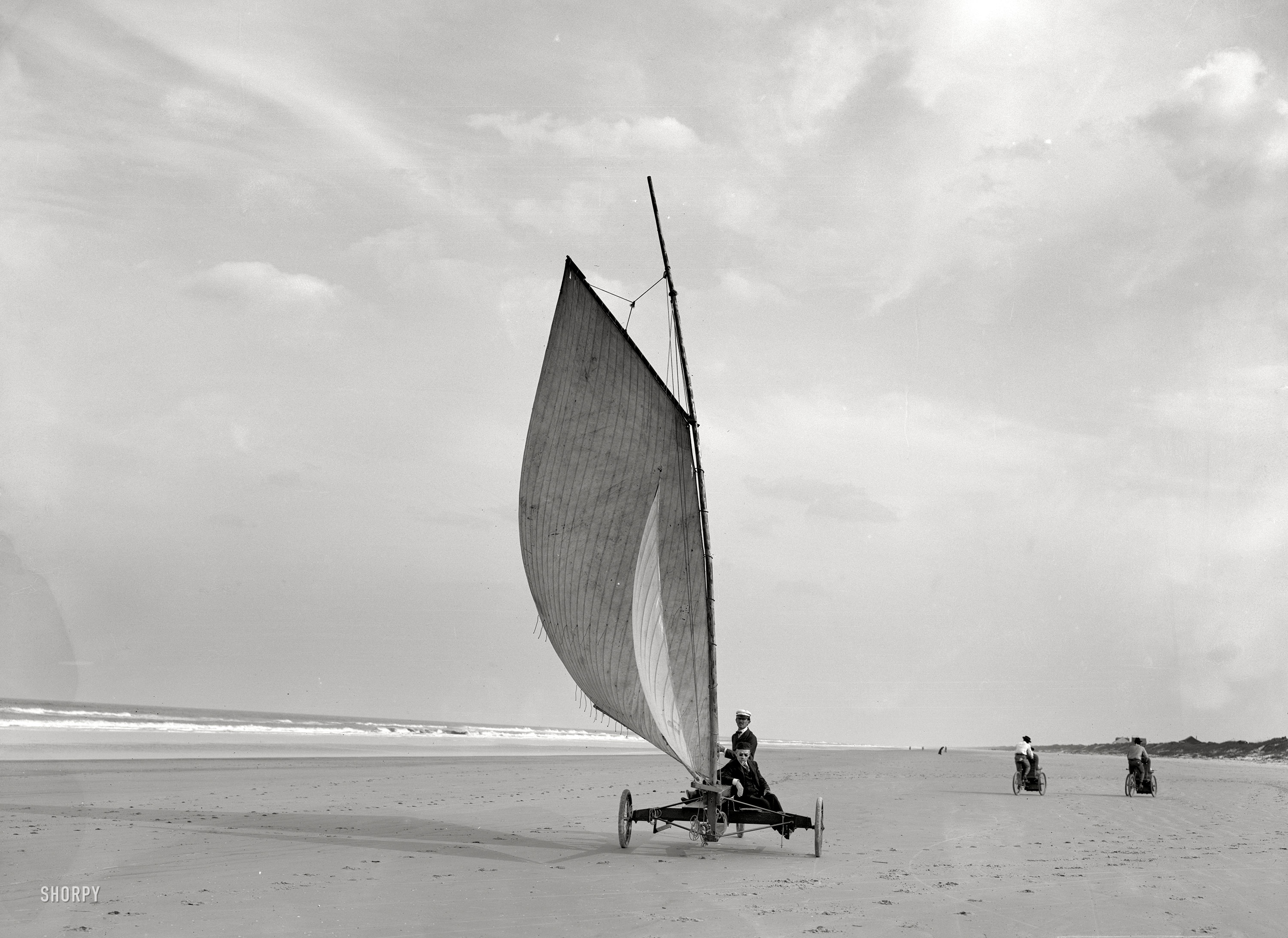 Circa 1903. "Sailing on the beach at Ormond, Florida." An interesting looking character at the controls. 8x10 glass negative, Detroit Publishing. View full size.
