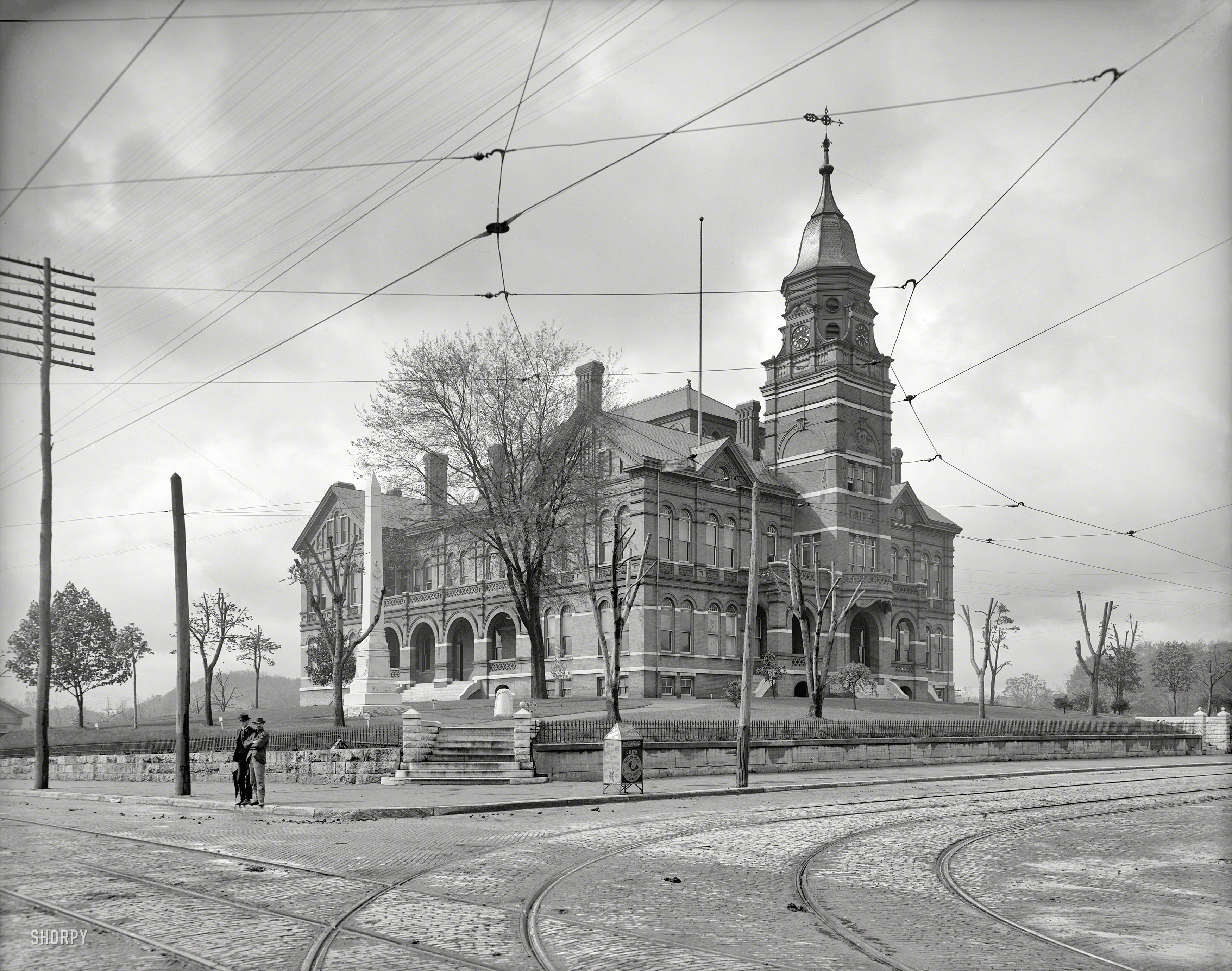 The Knoxville, Tennessee, courthouse circa 1903. With signage advising "Keep Off the Grass," "No Loafing," "Drink Hickman's Coffee" and "Chew Ram's Horn Tobacco." 8x10 glass negative, Detroit Publishing Company. View full size.