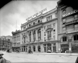 The Detroit Opera House circa 1904, starring an electric runabout out front. 8x10 inch dry plate glass negative, Detroit Publishing Company. View full size.
Detroit Conservatory MusicWhat, they were too cheap to spring for an "of"?
Digital sign againI've noticed that each time we've seen one of those "digital" signs it's been on or in front of a large theater, opera house or concert hall, the type of venue you'd expect the upper classes, rather than the hoi-polloi, to frequent. My speculation: it's something used to signal carriages for their ritzy patrons. Below: this one compared to ones at Philadelphia's Nixon Theatre and Academy of Music.
Update: Thanks to TomHe for confirming my speculation.
High Bridge?Look in the window of the Pennsylvania Lines shop.  Is the picture on the easel that of the High Bridge of recent memory?
[Unfortunately, no. - tterrace]
Videochas PicThat's Horseshoe Curve, near Altoona, PA
Makes My Heart SingWhat a lovely building! I was born in the wrong era. I come to Shorpy everyday and I'm never disappointed with the photos here. I would hope this building is still standing. I absolutely love the honeycomb glass transom at the entrance door. I wish buildings of today had the details of old world craftsmanship. Sigh.
[Demolished 1966. - tterrace]
What is that thang?Sharp eyes as usual from tterrace, but I can't make out just how this configuration of three identical sets of light-bulb "dots" could be lit to form letters or numbers. The mysterious device's Academy of Music installation, at right, appears to include some kind of identifying signage on the end of the clapboard base beneath it. Dave, is your highest-res tiff file of this photo sufficiently clear to read that information?
[Not clear enough on the full LOC tiff, unfortunately. - tterrace]
Pennsylvania LinesThe Pennsylvania Railroad was a late arrival in Detroit, not gaining a direct entrance there until 1922, and then only by trackage rights on the Ann Arbor, Pere Marquette  and Wabash Railroads. The Grand Rapids and Indiana Railroad was chartered in 1854 to build a line from Fort Wayne to the Straits of Mackinaw through Grand Rapids. It became part of the Pennsylvania Lines in 1869. It too had no direct connection to Detroit, relying on a connection with the Wabash in Ft. Wayne to get to the Motor City.
Identify car?Great picture! Can anyone identify that nifty little car?
The proverbial needleConcerning identifying the automobile, unless it was built by a select few makers, I doubt it can be positively identified.  
During this period there were around a thousand automobile manufacturers in America alone.  What we do know is that it's an early brass era runabout with tiller steering, semi-eliptical leaf springs at each corner, and wooden spoked wheels.  That should narrow it down to about 50 manufacturers, some of which existed for only a few years.
Re: The proverbial needleI think I have identified the car.  It's an AJAX ELECTRIC. I have attached a photo from an advertisement from 1903, for visual comparison.
[Here they are together. Among other differences, note the absence of front leaf springs. - tterrace]
Wright &amp; KayThe jewelry firm of Wright &amp; Kay (big sign atop building) was formed in May 1906 by Ohio native Henry M. Wright (a Civil War veteran as a member of Co. B, 85th Ohio Volunteers) and John Kay, who was born in Scotland. They were jewelers, opticians, importers and dealers in watches, clocks, diamonds, marble statuary, silver and plated ware and fine stationery, and they manufactured watches and other products under their own name. Recently some Wright, Kay &amp; Company watches were auctioned at Christie's.  
About that haystackMy first thought when I looked at the full-size image was Studebaker. After further research the answer will have to be no, they were building a Runabout with very similar bodywork and proportions in that era but it had major mechanical differences from this machine.
As BradL said, this was a time when literally hundreds of companies ranging from blacksmiths, to buggy shops, to established manufacturers of sewing machines and other mechanical equipment, all took a fling at the automobile. 
MysterymobileI'm almost certain it's a Waverly Runabout, built in Indianapolis. I have a current-day photo but it's somebody's property. Note its steering is via a front tiller whereas the Studebaker has its tiller on the side.  
Re: Digital sign againA carriage call indeed. Picture below shows numbers lit.
WaverleyDon Struke has it, I found a vintage Waverley advertisement that certainly seems to match the mystery car closely.
HorsesCalm and unaware that they were about to be unemployed in very short time.
(The Gallery, Cars, Trucks, Buses, Detroit Photos, DPC, Performing Arts)