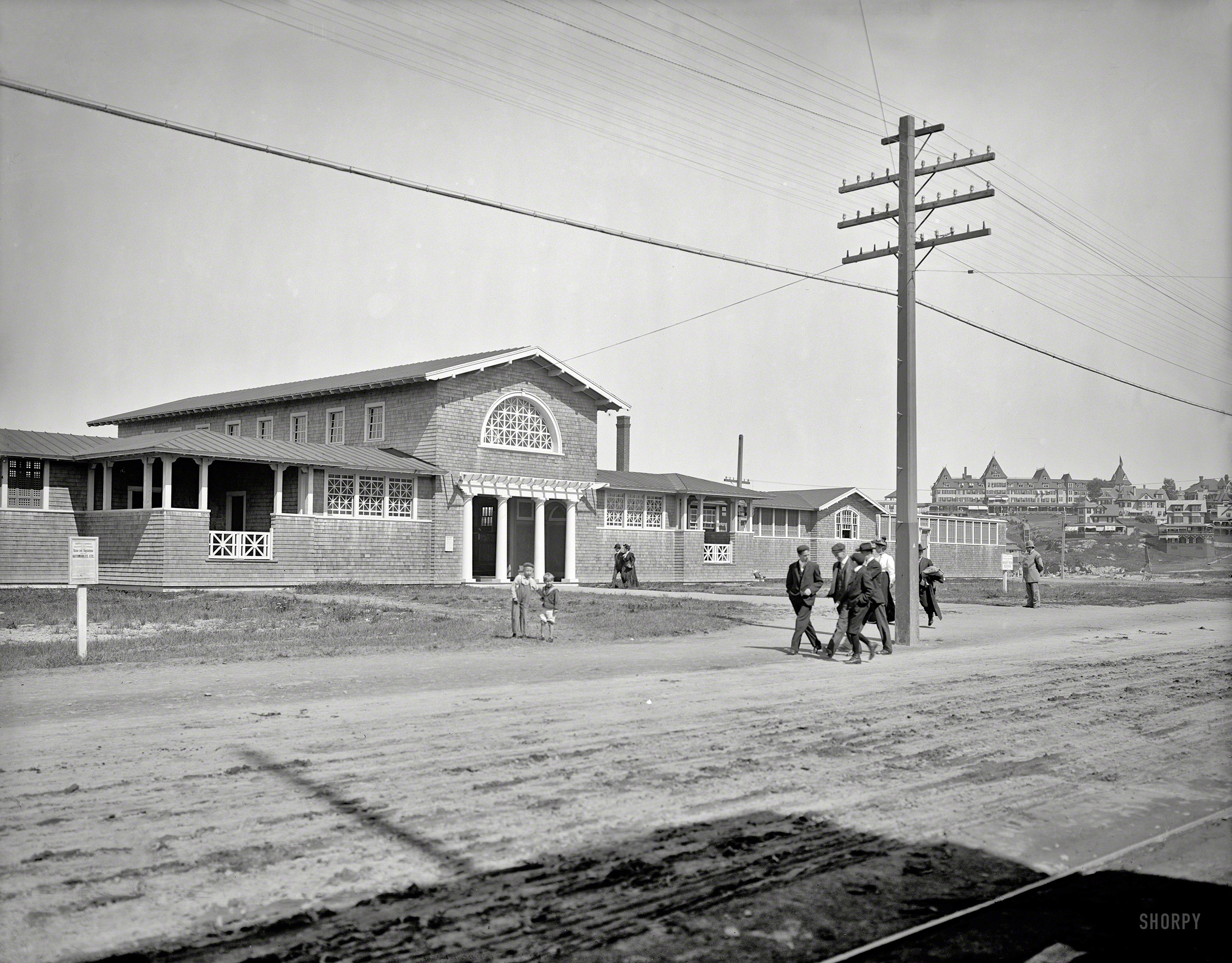 Circa 1905. "Bath house, Nantasket Beach, Mass." Note the "Rules and Regulations for Automobiles, Etc." posted at left. 8x10 glass negative. View full size.