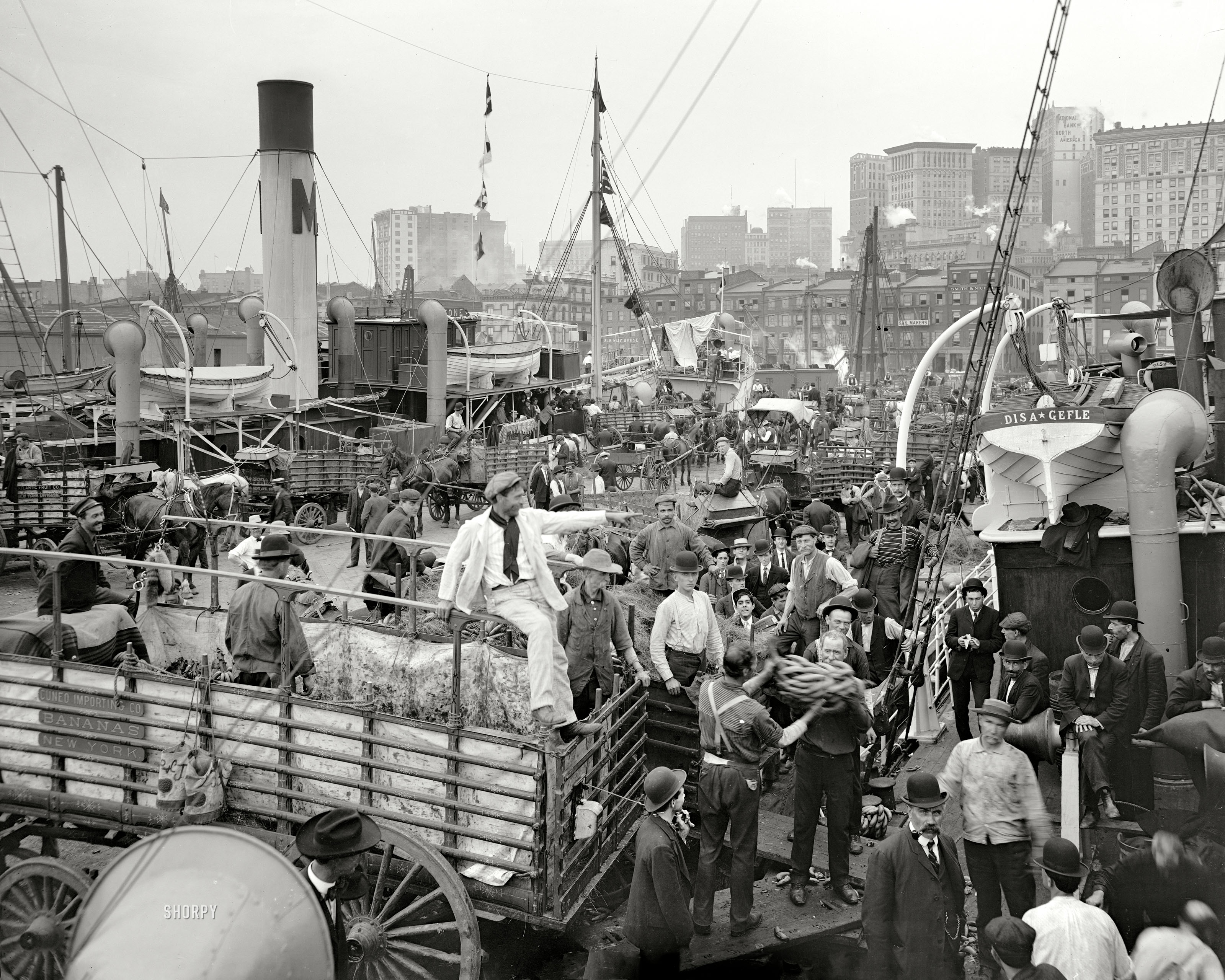 Circa 1906. "Banana docks, New York." An interesting cast of characters. 8x10 inch dry plate glass negative, Detroit Publishing Company. View full size.