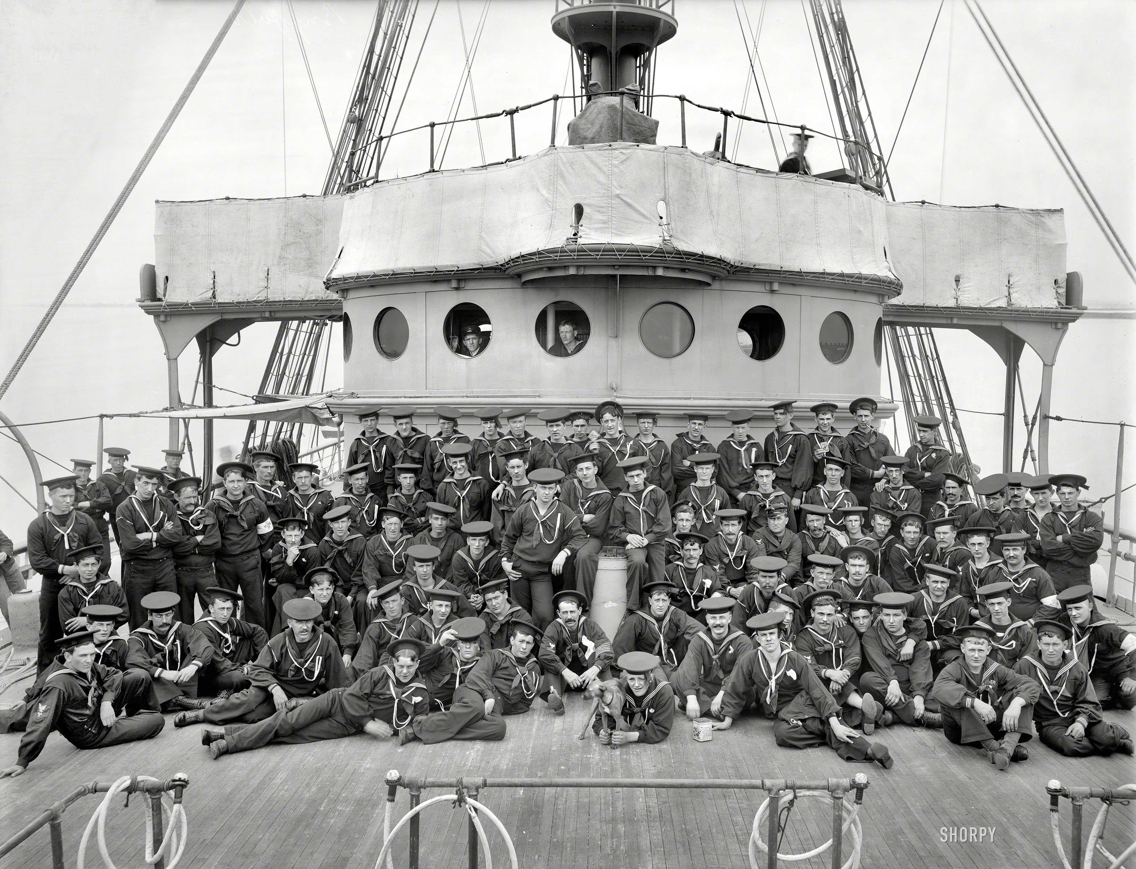 Circa 1900. "U.S.S. Buffalo, ship's company." A certain amount of mugging for the camera here, as well as various props and a canine mascot. 8x10 inch dry plate glass negative by Edward Hart, Detroit Publishing Company. View full size.