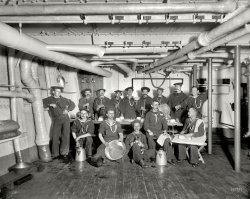 1896. "U.S.S. Maine -- berth deck cooks." And their feline mascot. 8x10 inch glass negative by Edward H. Hart, Detroit Publishing Co. View full size.