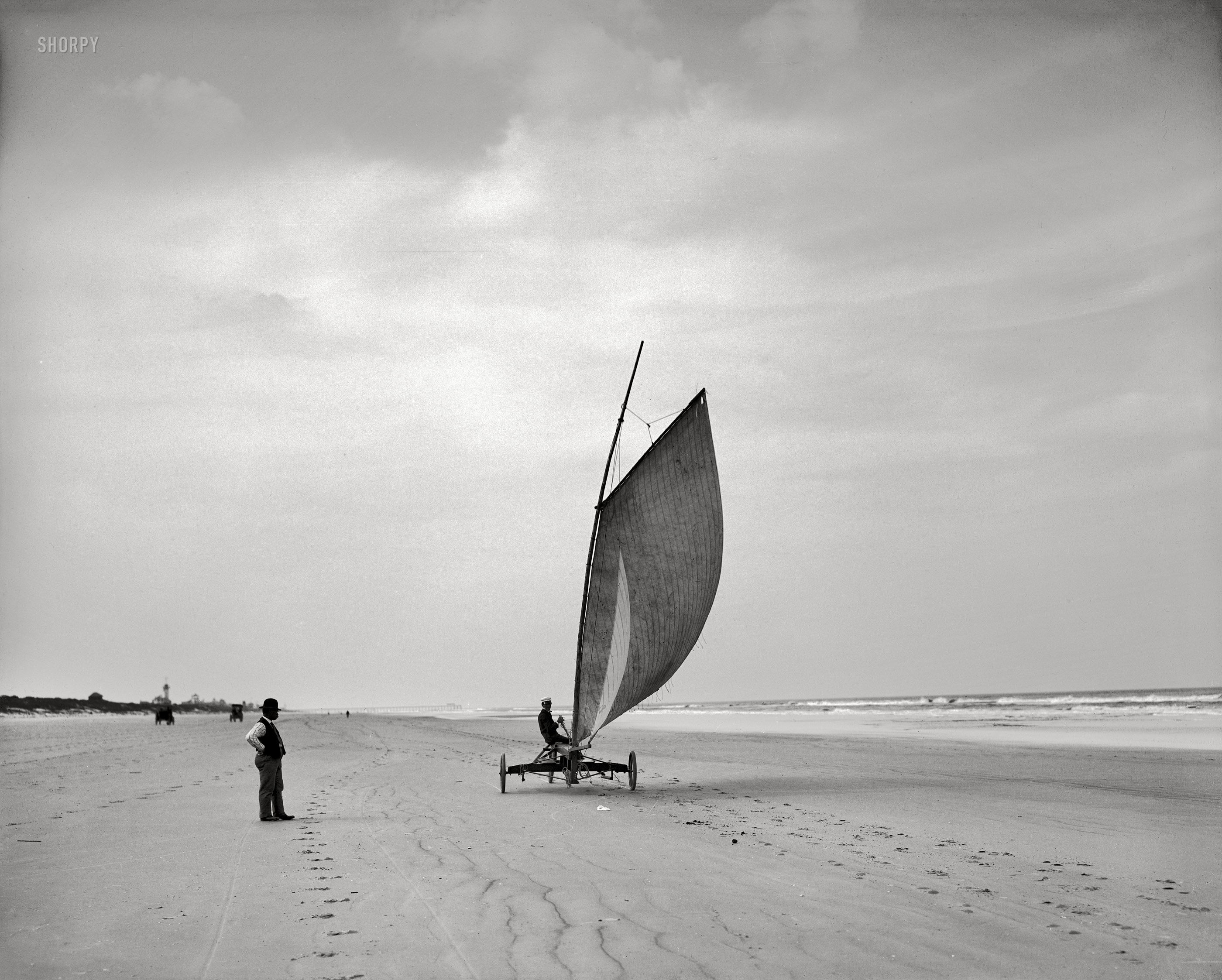 Circa 1905. "Sailing on the beach -- Ormond, Florida." It'll never take off. 8x10 inch dry plate glass negative, Detroit Publishing Company. View full size.