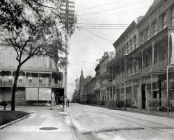 Mobile, Alabama, circa 1906. "Dauphin Street." Shoes to the right, hats to the left. 8x10 inch dry plate glass negative, Detroit Publishing Company. View full size.