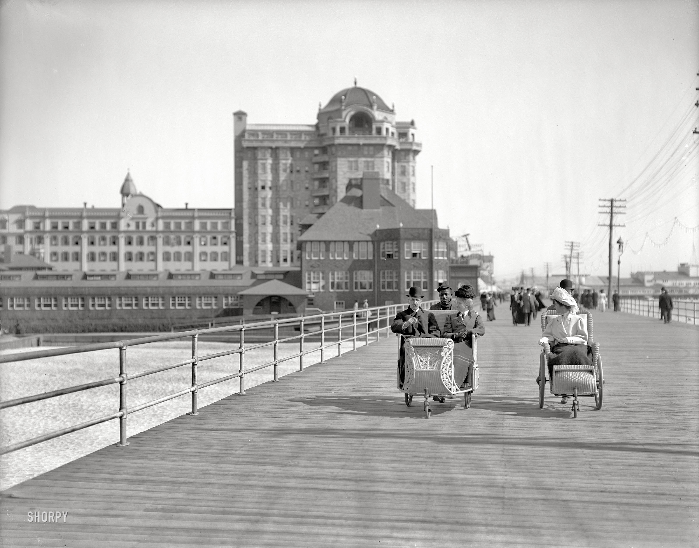 The Jersey shore circa 1906. "Rolling chairs on the Boardwalk, Atlantic City." Hotel Traymore in the background. 8x10 inch glass negative. View full size.