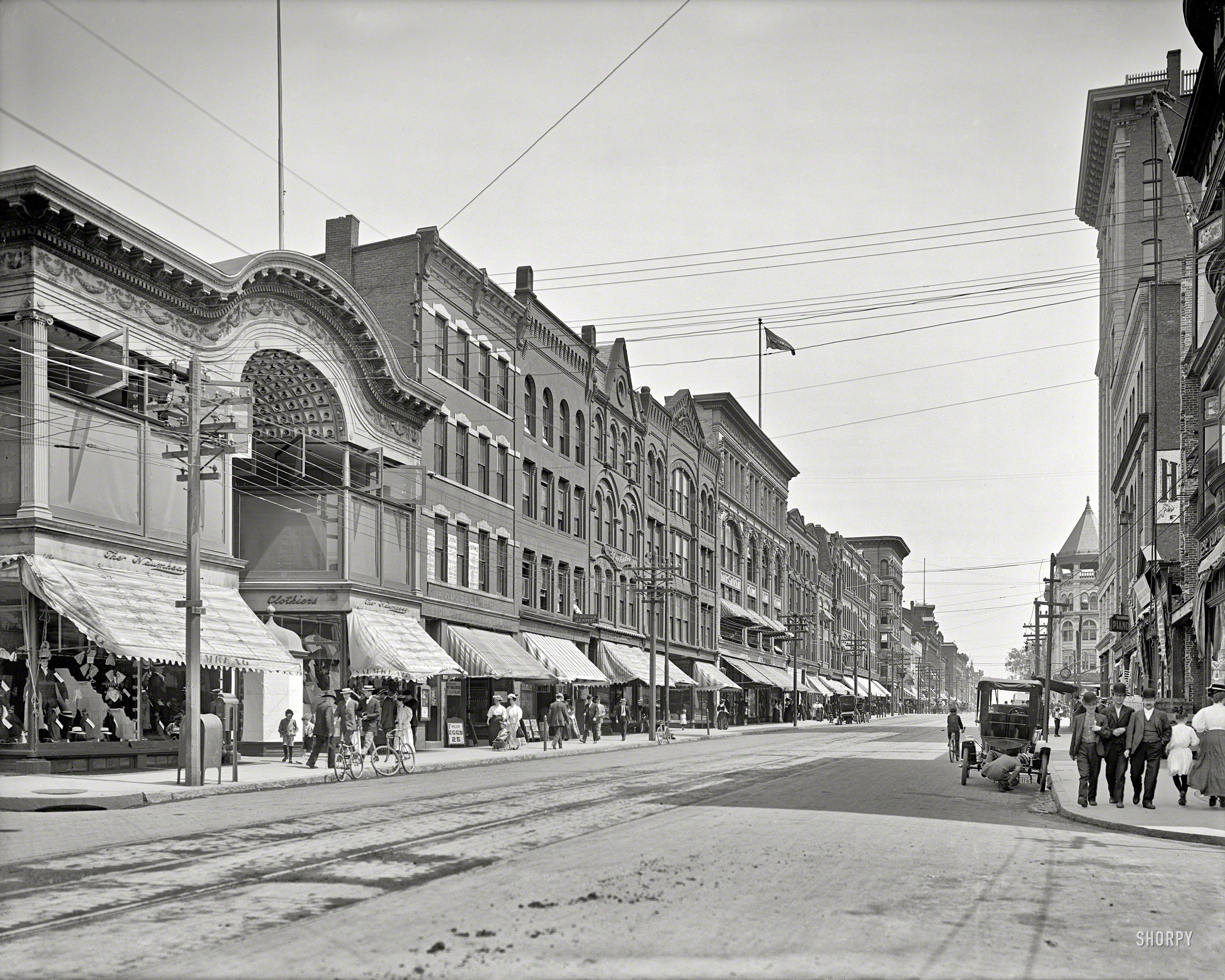 Circa 1908. "High Street -- Holyoke, Massachusetts." High Street highlights include the Three Amigos as well as Guy Checking Out Car. View full size.