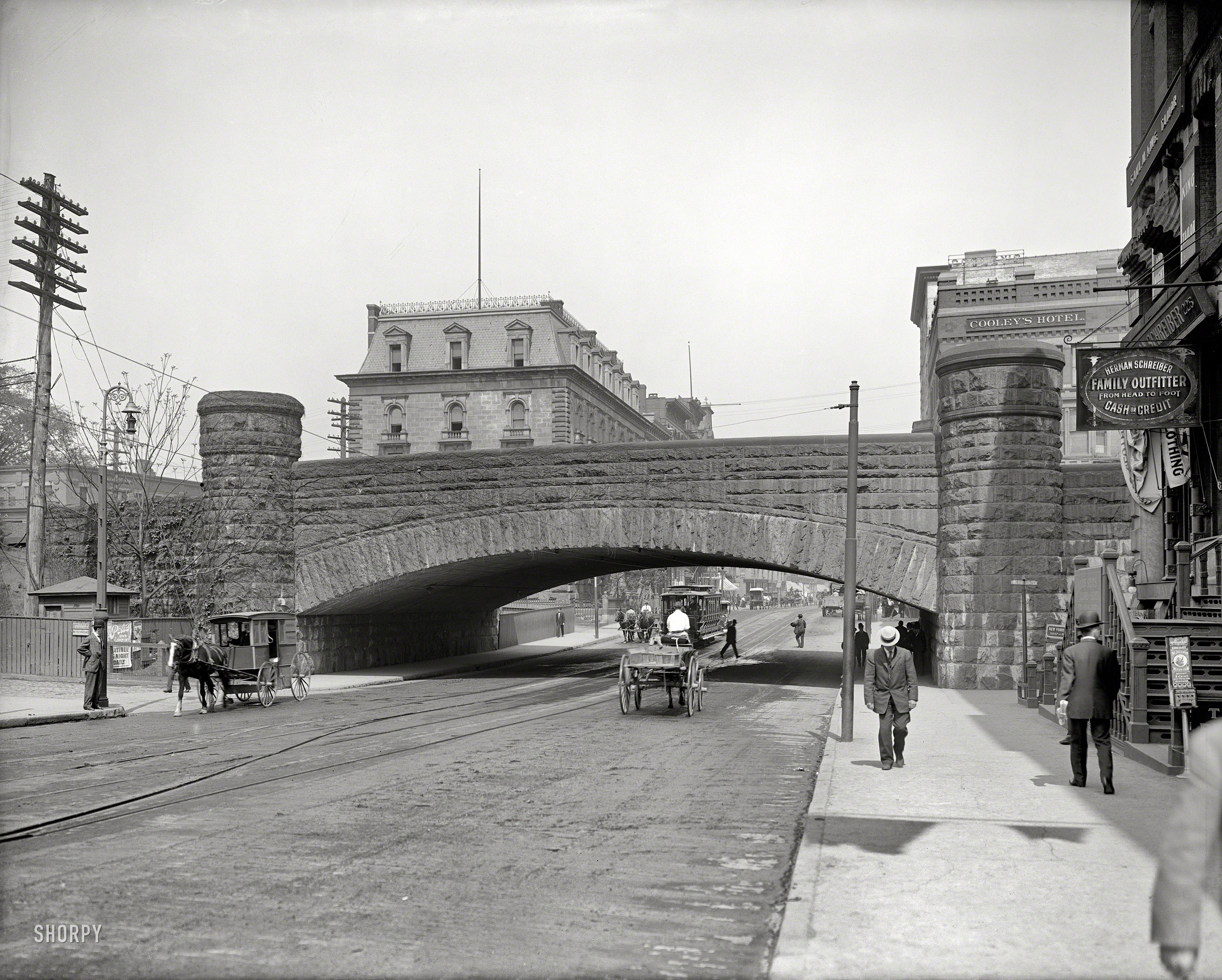 Springfield, Mass., circa 1908. "Railroad arch on Main Street." Seen here a couple months ago from another vantage. 8x10 glass negative. View full size.