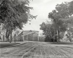 Circa 1908. "North End bridge, Springfield, Massachusetts." Points of interest include the signal light on the pole and sign on the bridge. 8x10 inch dry plate glass negative, Detroit Publishing Company. View full size.