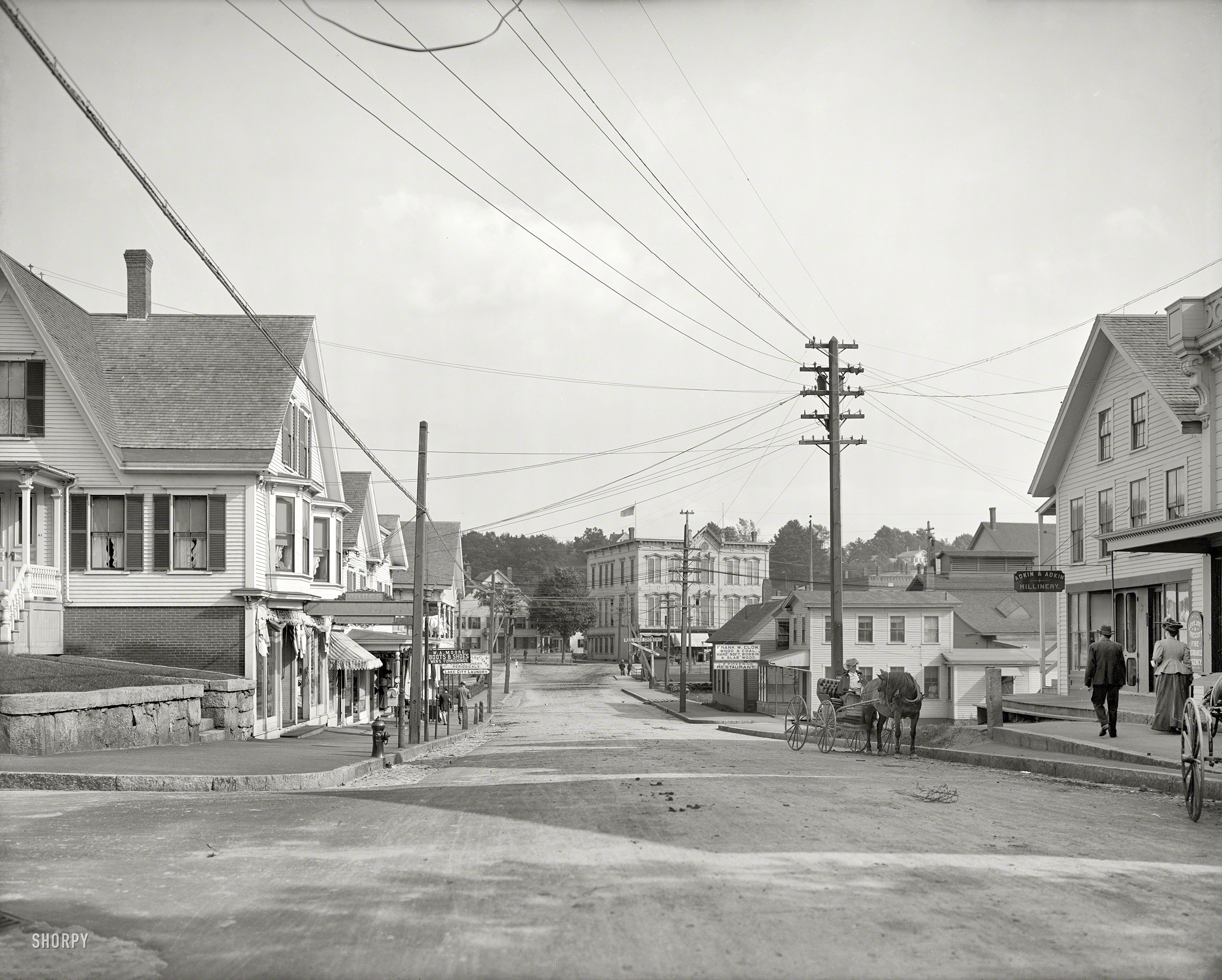 Circa 1907. "Street in Lakeport, New Hampshire." Points of interest in this view of the fair city (last seen here) include the Lovejoy & Prescott fire insurance agency, Adkin & Adkin Millinery, the L.E. Pickering restaurant, Frank Clow Wood & Coal ("Hard, Soft, Bobbin & Slab"), W.A. Moore Boots & Shoes, and a lady having a conversation with her horse. Not pictured: sign painter with a graduate degree in ampersands. 8x10 glass negative, Detroit Publishing. View full size.