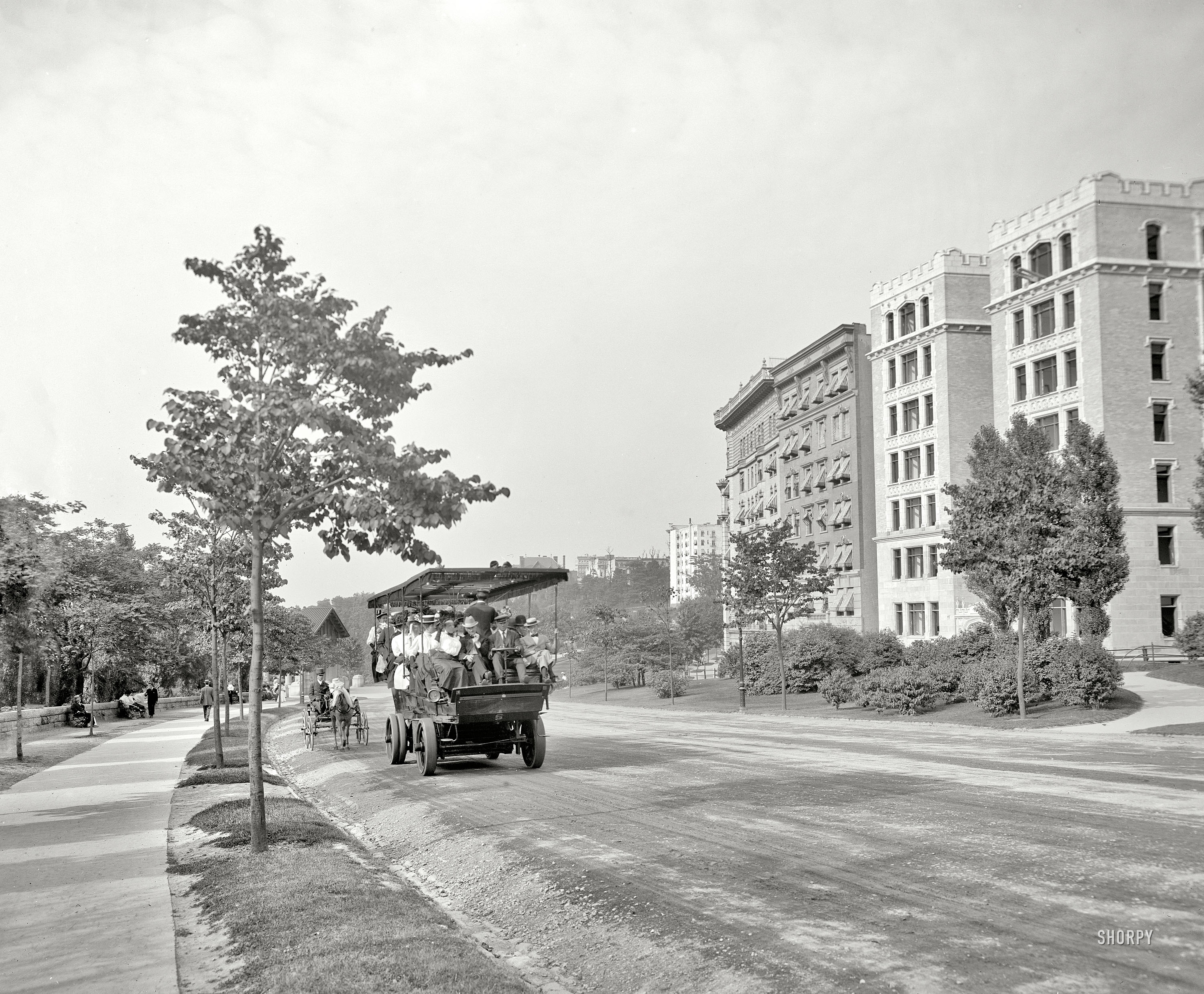 Circa 1908. "Riverside Drive, New York." Tourists in an electric charabanc or "automobile bus." 8x10 glass negative, Detroit Publishing Co. View full size.