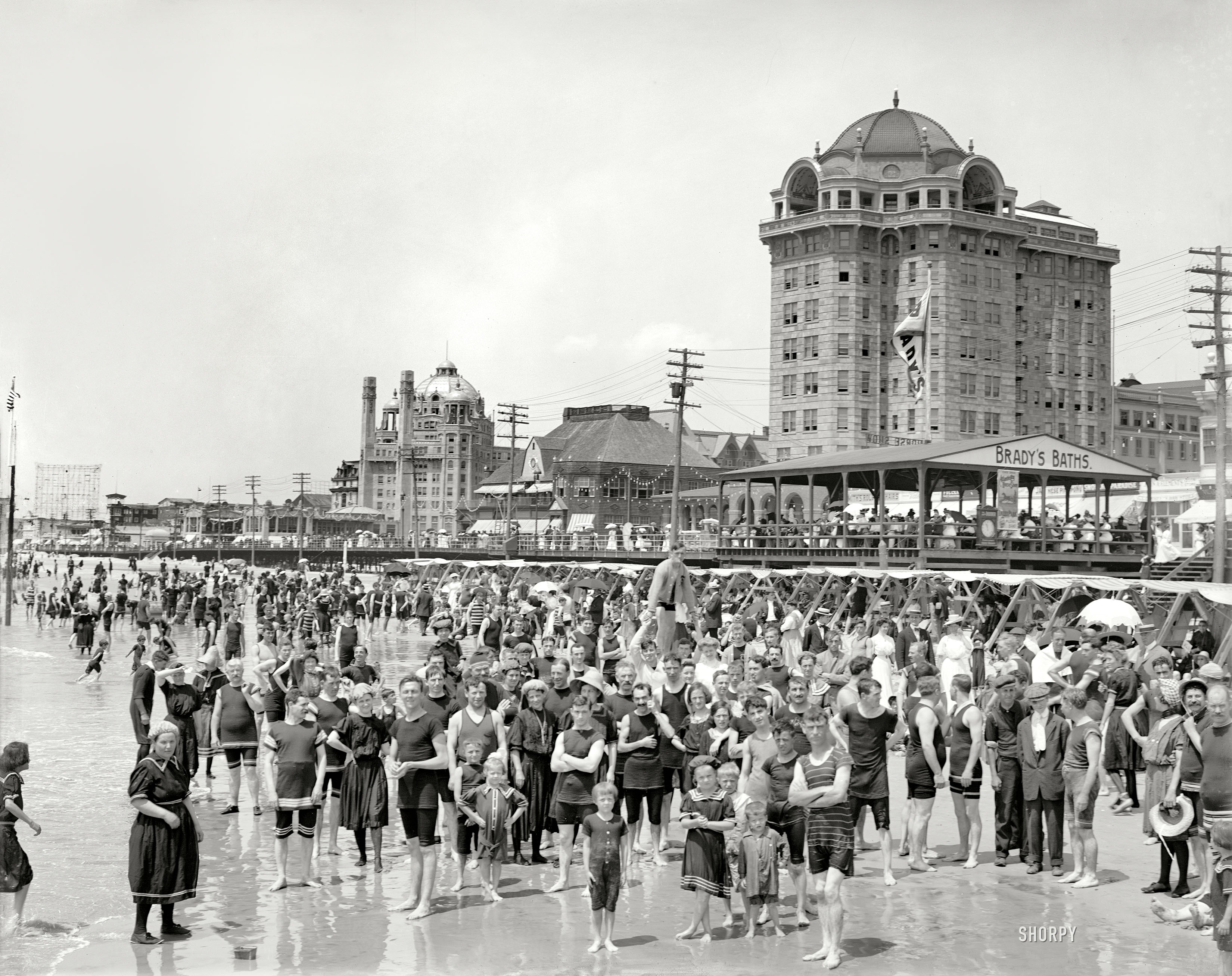 Circa 1906, Atlantic City bathers peering a century into the future. "Hotel Traymore and Brady's Baths." At left, the domed Marlborough-Blenheim hotel. 8x10 inch dry plate glass negative, Detroit Publishing Company. View full size.