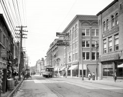 Utica, New York, circa 1910. "Bleecker Street." Your source for vaudeville and "Kodaks." 8x10 inch glass negative, Detroit Publishing Company. View full size.
