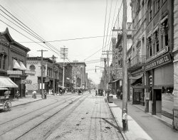 Knoxville, Tennessee, circa 1905. "Gay Street looking north from Clinch Avenue." Featuring the Mayor of Gay Street, and sponsored by Mexican Mustang Liniment. 8x10 inch dry plate glass negative, Detroit Publishing Company. View full size.