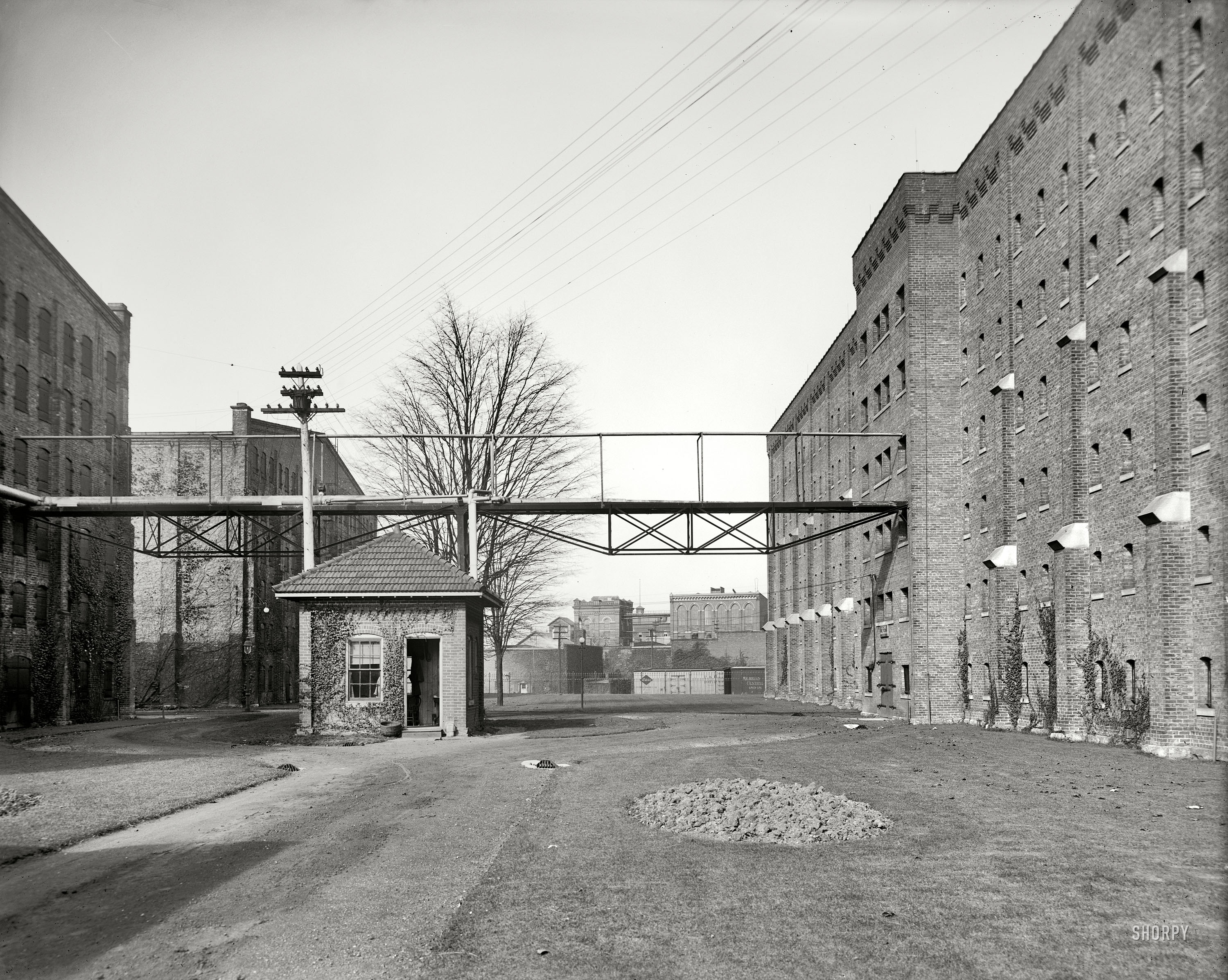 Walkerville, Ontario, circa 1900. "Avenue of rack warehouses, Hiram Walker & Sons." 8x10 inch dry plate glass negative, Detroit Publishing Co. View full size.