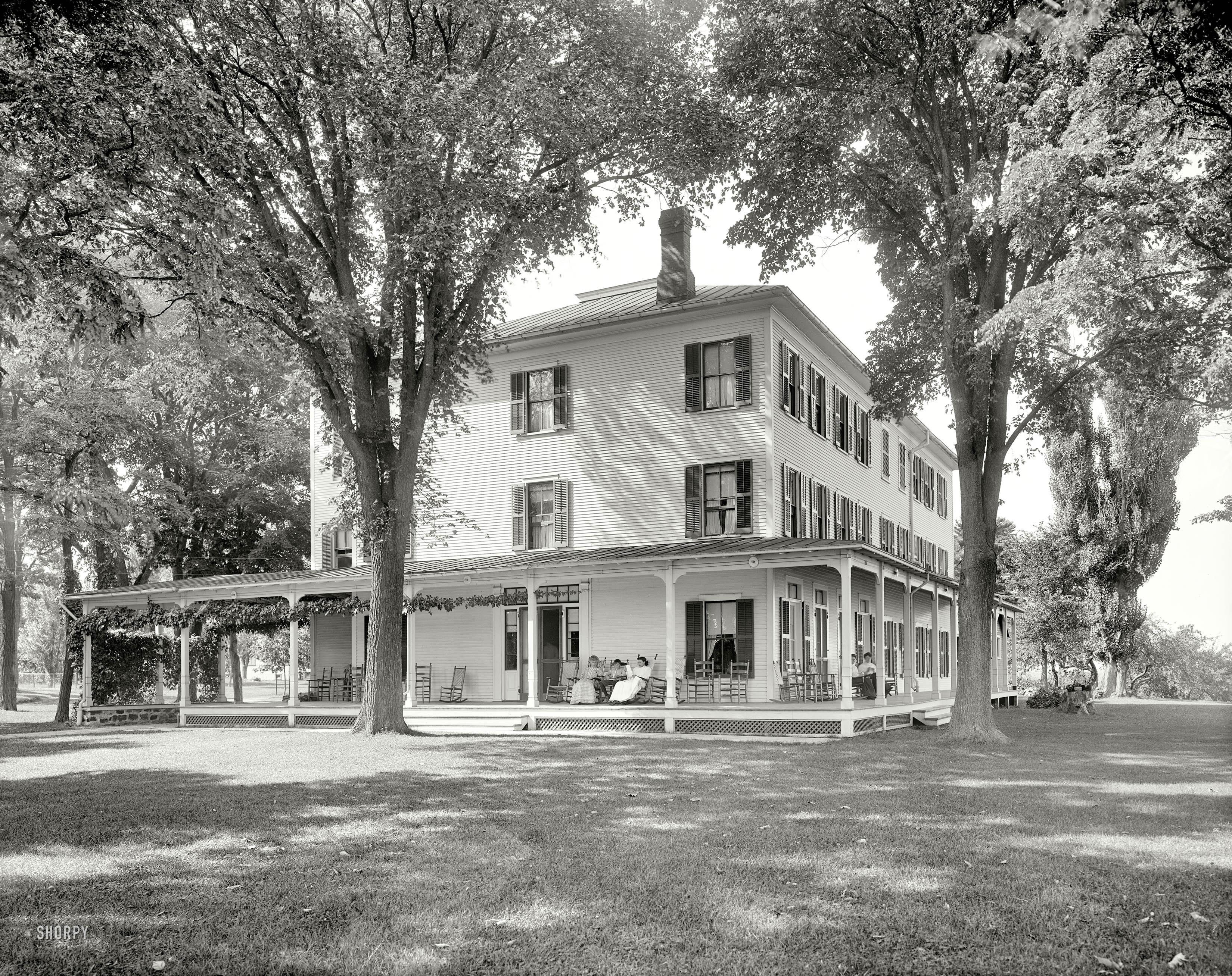 Circa 1910. "Trembleau Hall. Port Kent, N.Y." Old-school rockers. 8x10 inch dry plate glass negative, Detroit Publishing Company. View full size.
