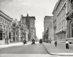 New York circa 1908. "Fifth Avenue hotels north from 51st Street." 8x10 inch dry plate glass negative, Detroit Publishing Company. View full size.
Ivy-covered walls at 51st and Fifth!That's Central Park up ahead, where the Plaza Hotel and Apple's all-night store now stand face to face.
It looked so much nicer a century ago.
That vehicle in the centerlooks like an armored car.
[It's an electric taxicab. - Dave]
+98Below is the same view from April of 2006.
1906 Fifth Avenue PostcardThis postcard in my family collection shows a similar, but earlier view of Fifth Avenue.
GrandeurIt just looks to me as though life was so much richer and dignified then. I think a nation's architecture speaks a lot about the mindset of the people.
That churchAny one know which church that is on the left. At first I thought it was St. Patrick's but St. Pats is behind to the right.
A high point in Central ParkIf you look in the distance at Central Park, it looks like there is a small mountain there. Was there a hill that was excavated in the forming of the park?
Vanderbilt RowIn the foreground on the left is the Vanderbilt double mansion built by William H. Vanderbilt at 640 Fifth Avenue for himself and two daughters.  In 1908, Henry Clay Frick was in his third year of living there at a reported annual rental of $50,000.  http://nyarc.org/content/vanderbilt%E2%80%99s-house-dreams
You can see the surviving half of the house in 1933 surrounded by much taller neighbors in this classic Shorpy photo, next to what will become Rockefeller Center.  https://www.shorpy.com/30-Rock  It finally bit the dust in 1947.
And right across 52d Street is the celebrated home of his second son William K Vanderbilt, which made it to the 1920s.
So sad, bye byeI'm always a little shocked and saddened by the changes made by "progress" but this all really takes the cake. Everything appears to be gone and it all looked beautiful to my untrained eye.  I've noticed that whenever I see cupolas or turrets in an old photo, you can almost bet that building will be gone. Speaking of which, my favorite building, the one just to the left with the very pointed peak, has two interesting items that I don't quite understand.  One, the windows all look open, but way too "open" for this construction if you get my drift. And two, whats with the guy on the chimney?
Houses of the VanderbiltsOn the left side of the avenue, we can see several houses belonging to the Vanderbilt family: First is a part of the double house (actually 3 houses) covering the whole block between 51st and 52nd Streets, built  for William Henry Vanderbilt (son of the Commodore) and his two married daughters. These houses were designed by the decorating firm of Herter Brothers and built between 1879 and 1882. Next, at the northwest corner of 52nd Street, is the house designed by Richard Morris Hunt for William K. Vanderbilt (one of the Commodore's grandsons) and built in 1879-1882. This landmark of old New York was also known as the "Petit Chateau." I'm fairly certain that the smaller house right next to it was also built for a Vanderbilt, but I can't remember which one (!) The very last building visible on this side of the street, between 57th and 58th Streets, would be the Cornelius Vanderbilt II House, designed by George B. Post for another grandson of the Commodore. This last house was built in two phases, the first in 1881-1882 and the second in 1892-1894.
Flue with a view Please tell me that that's a brave sweep taking in the view on his lunch break, and not a boring piece of statuary (to the left of the very Cinderella-looking turret)!
Re: That churchThat's the Fifth Avenue Presbyterian Church http://www.fapc.org/our-church/history which still stands at 55th Street.
St. Thomas Church at 53rdThere are actually two churches visible on the left side of Fifth Avenue - the first of which is the tower of St. Thomas Episcopal Church, at the northwest corner of Fifth Avenue and 53rd Street.  The Church burned in early August 1905, but the tower reportedly survived.  From this angle, in fact, it's difficult to see any fire damage; the facade of the front door of the church seems intact.
Between 1907 and 1909, the City widened Fifth Avenue between 23rd and 47th Streets, by taking 7 1/2 feet from sidewalks on each side, but by July 1909 that project had not yet reached further north, to this area.  
660 Fifth AvenueThe French Chateauesque mansion second block on the left is the William K. Vanderbilt house, designed by Richard Morris Hunt. I seem to remember from an episode of A&amp;E's America's Castles that the statue was relocated to a still existing Vanderbilt house on Long Island.
(The Gallery, NYC)