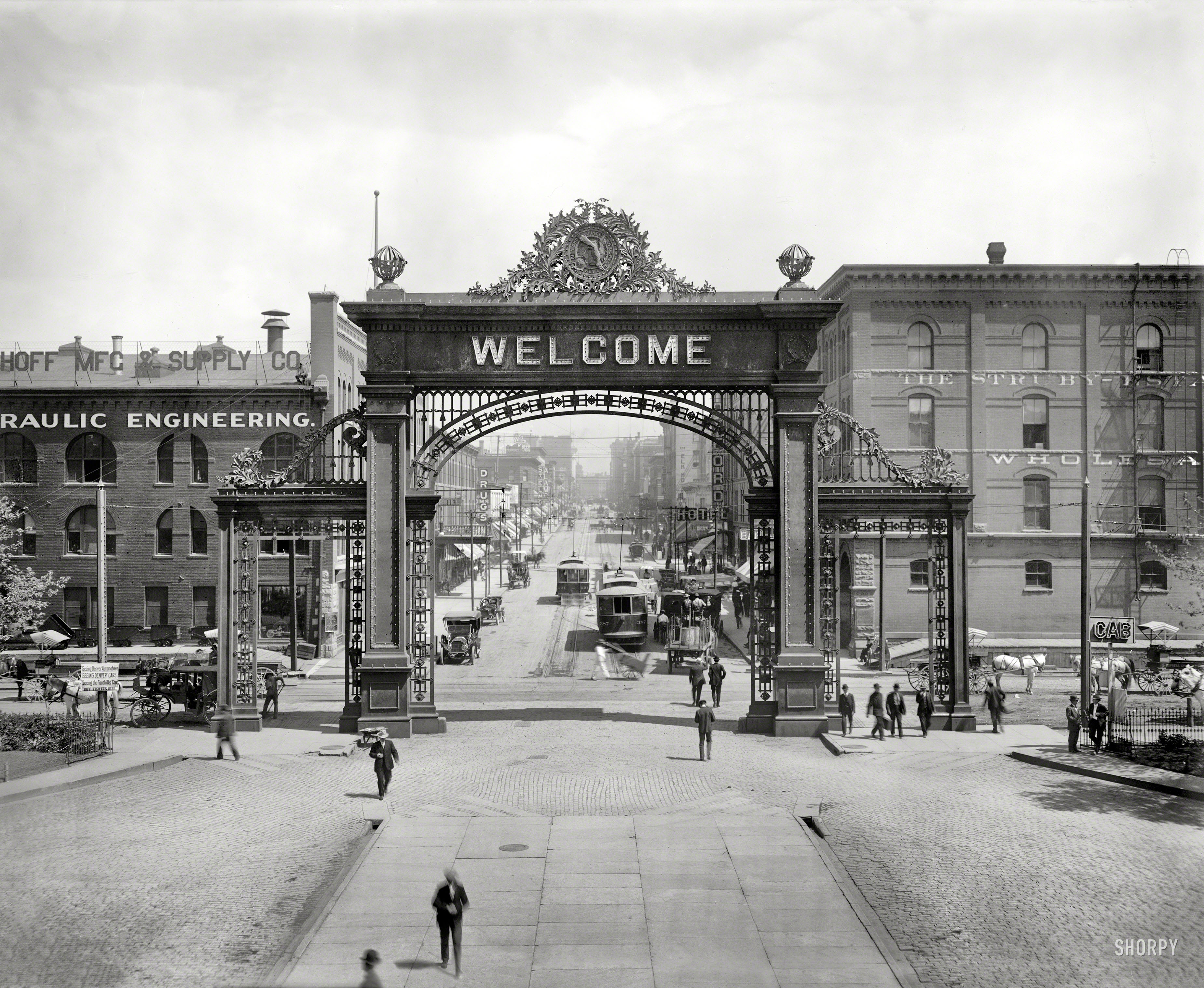 Denver, Colorado, circa 1908. "Welcome arch at Union Depot looking down 17th Street." The arch, with the Hebrew benediction "mizpah" soon replacing WELCOME on the other (departure) side, was torn down in 1931. View full size.