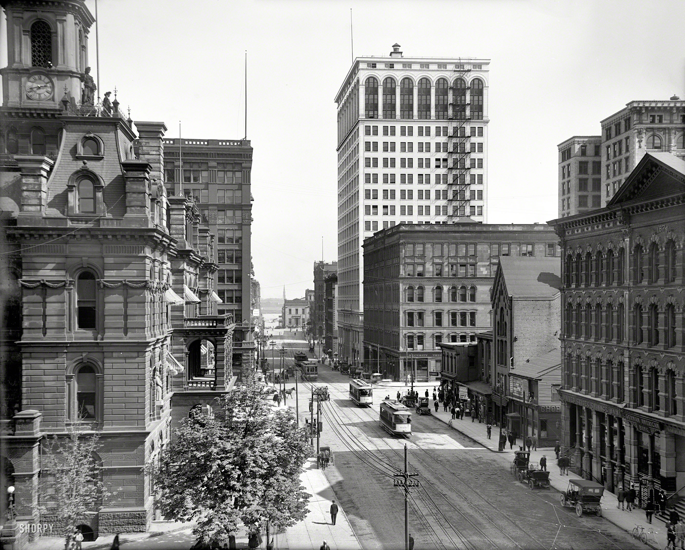 &nbsp; UPDATE: Note the baseball scoreboard on Sharpe's Chop House.
Detroit circa 1910. "Griswold Street south from Michigan Avenue." And a view of the recently completed Ford Building. 8x10 glass negative. View full size.