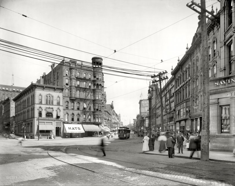 Grand Rapids, Michigan, circa 1908. "Monroe Street." Your headquarters for chatty chapeaux. 8x10 glass negative, Detroit Publishing Co. View full size.
