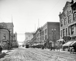 Little Rock, Arkansas, circa 1910. "Main Street." Home to a number of intriguing juxtapositions. 8x10 inch glass negative, Detroit Publishing Co. View full size.