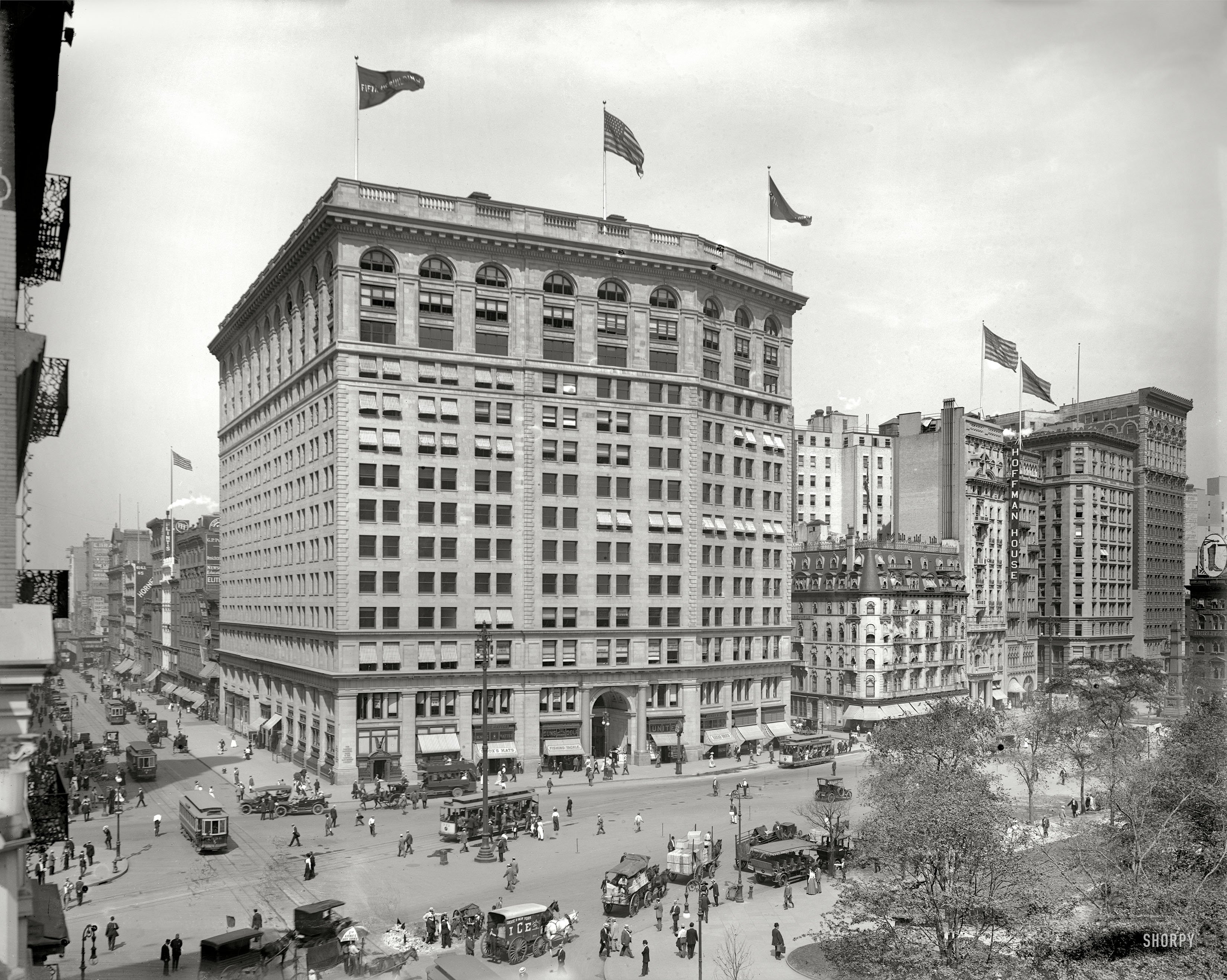 New York circa 1910. "Fifth Avenue Building at Broadway on Madison Square." Along with its celebrated sidewalk clock, the building now anchors the International Toy Center. Detroit Publishing glass negative. View full size.