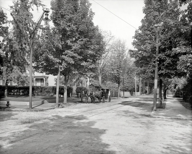 Circa 1910. "Beech Street -- Manchester, New Hampshire." Note the carbon arc lamp and its elaborate rigging. 8x10 glass negative. View full size.

